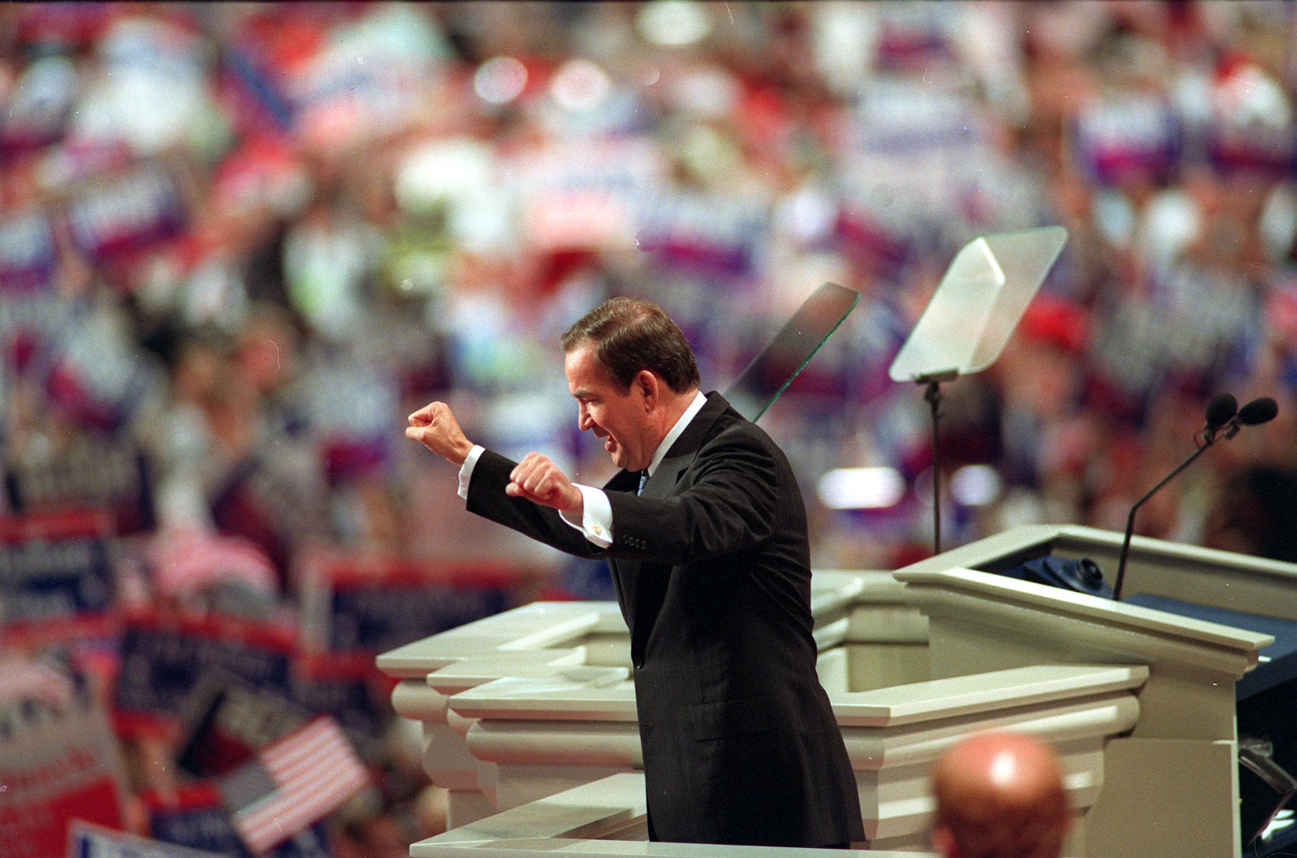 Patrick Buchanan acknowledges the cheers from the crowd during the Republican National Convention at the Houston Astrodome in Texas on Aug. 17, 1992.