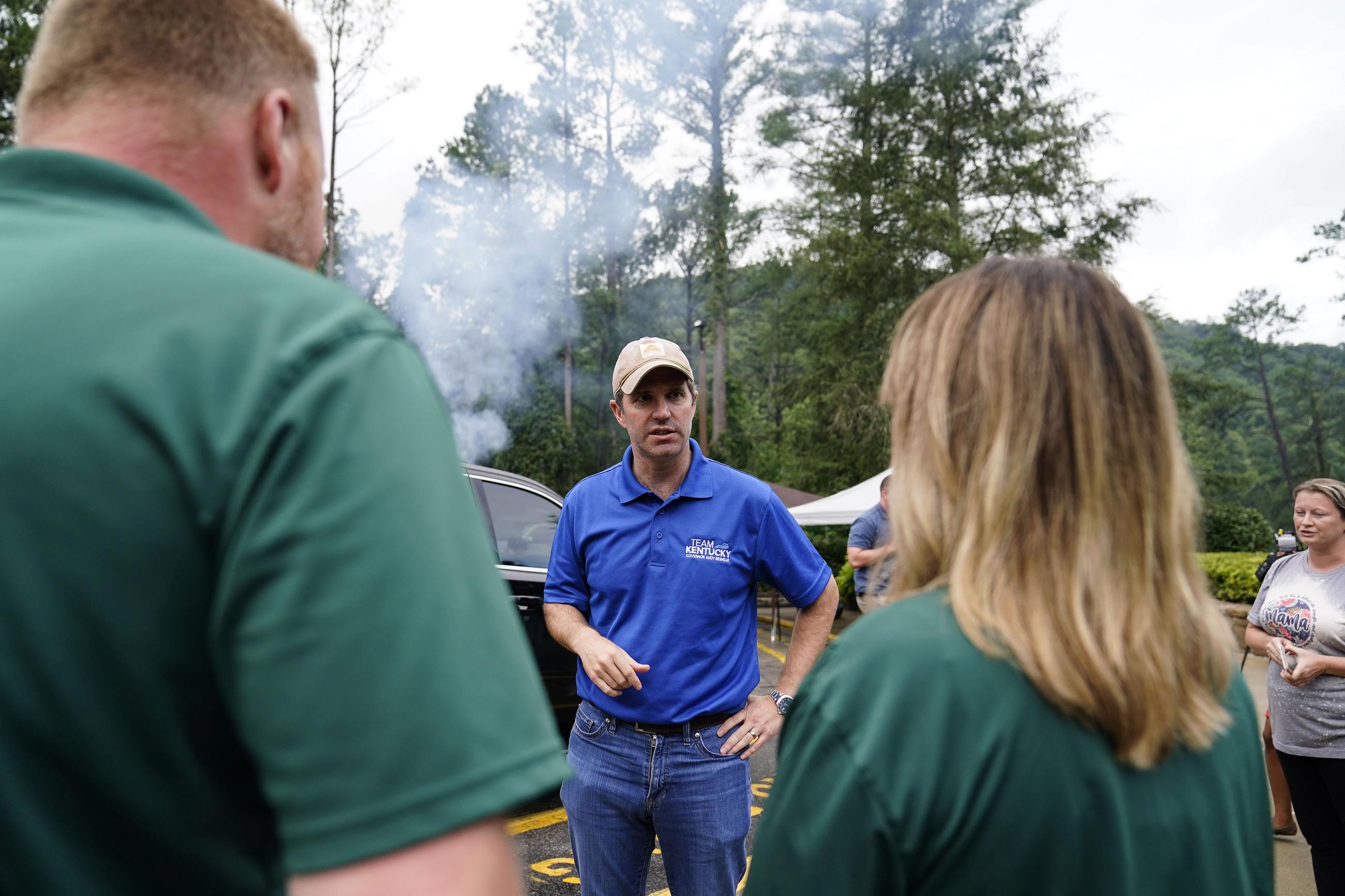 Kentucky Governor Andy Beshear, center, talks with residents that have been displaced by floodwaters at Jenny Wiley State Resort Park Saturday, Aug. 6, 2022, in Prestonsburg, Ky. (AP Photo/Brynn Anderson)