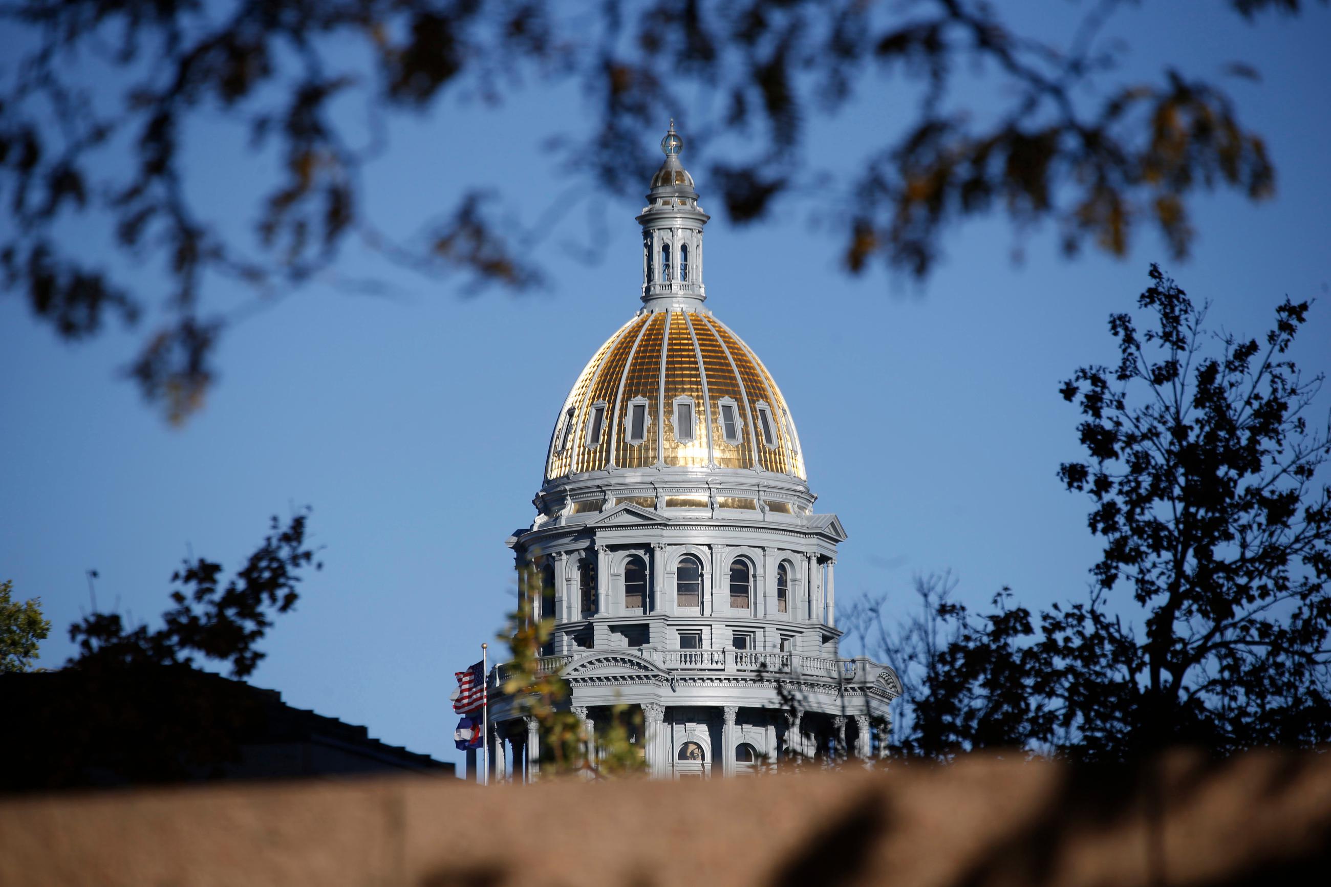 FILE - In this Nov. 3, 2015, file photo, the gold-covered dome on the state Capitol shines in the late afternoon sun in downtown Denver. Democrats buoyed by a wave of anti-Trump political activism are not only trying to wrest control of some legislatures from Republicans in the 2018 election, they're also striving to tighten their hold in states where they already have an edge, or where control is split, to pass legislation ranging from gun control, to taxation to health care. In Colorado and New York, Democrats hope to win one more seat in each state senate to gain control of both legislatures. (AP Photo/David Zalubowski, File)