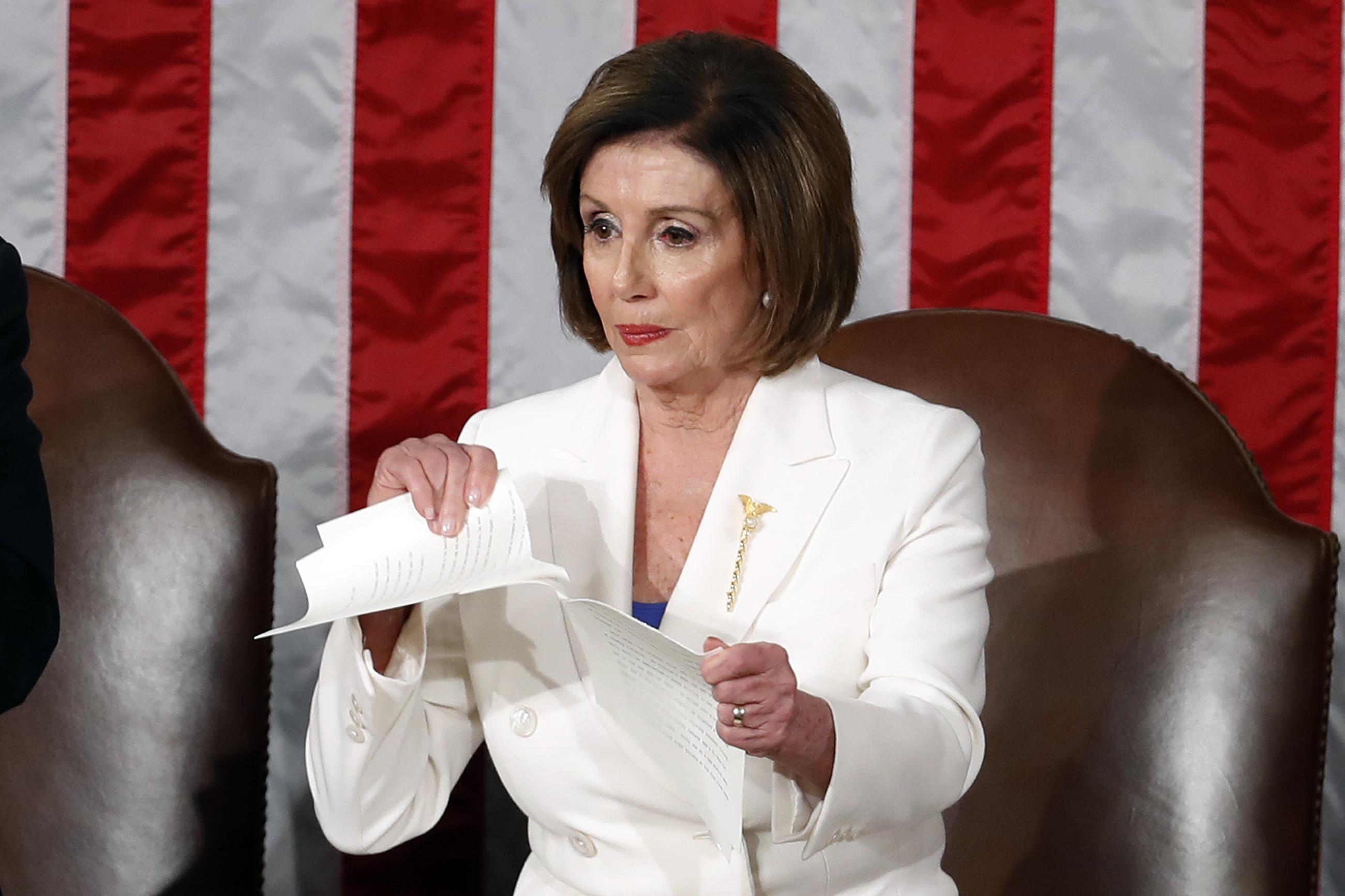 House Speaker Nancy Pelosi tears her copy of President Trump's State of the Union address after he delivered it to a joint session of Congress on Feb. 4, 2020. (AP Photo/Alex Brandon, File)