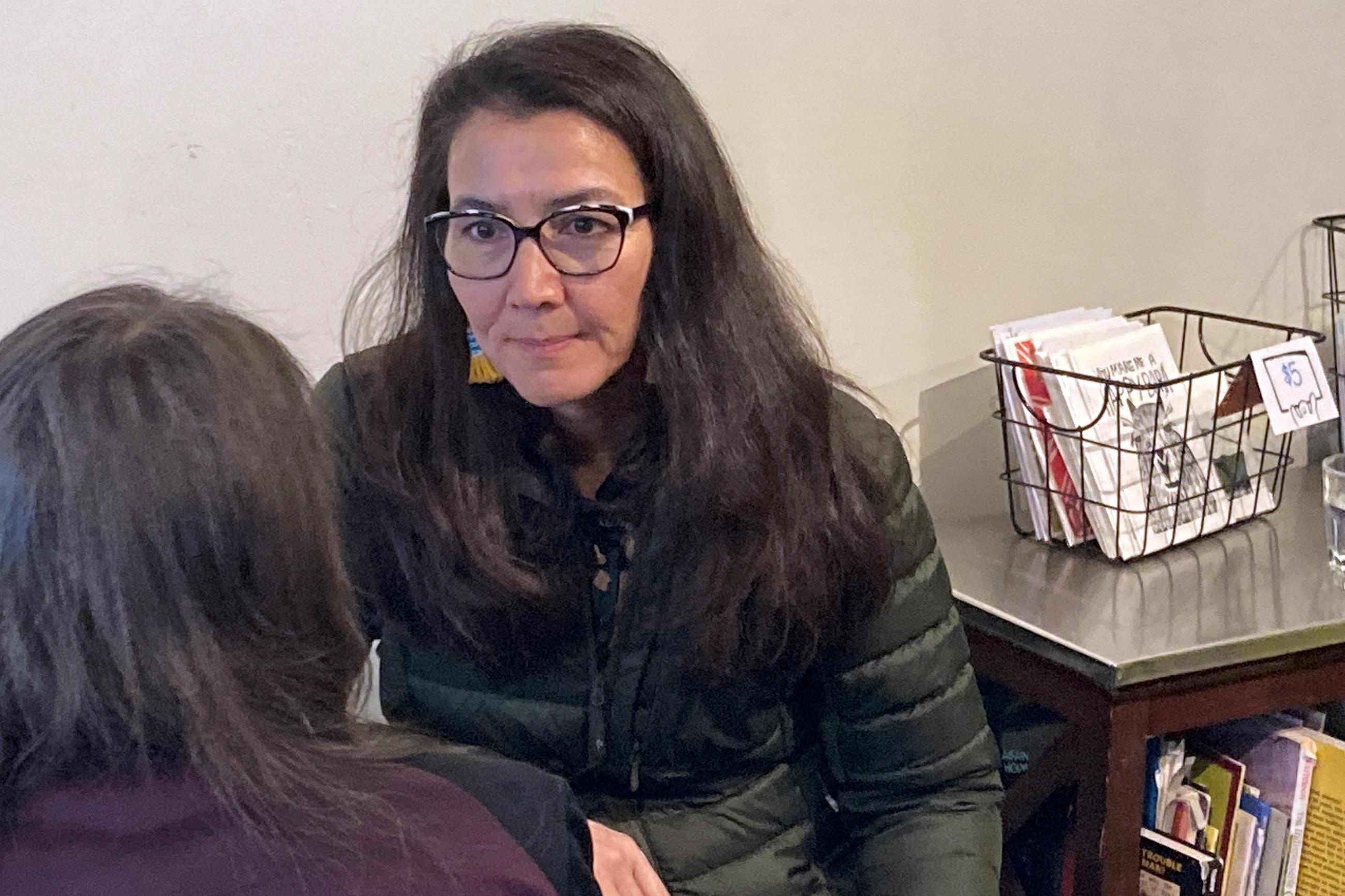 U.S. Rep. Mary Peltola, D-Alaska, listens during a meet-and-greet campaign event in Juneau, Alaska, on Tuesday, Oct. 25, 2022. Peltola faces Republican challengers Sarah Palin and Nick Begich and Libertarian Chris Bye in the Nov. 8 election for Alaska's only House seat. (AP Photo/Becky Bohrer)
