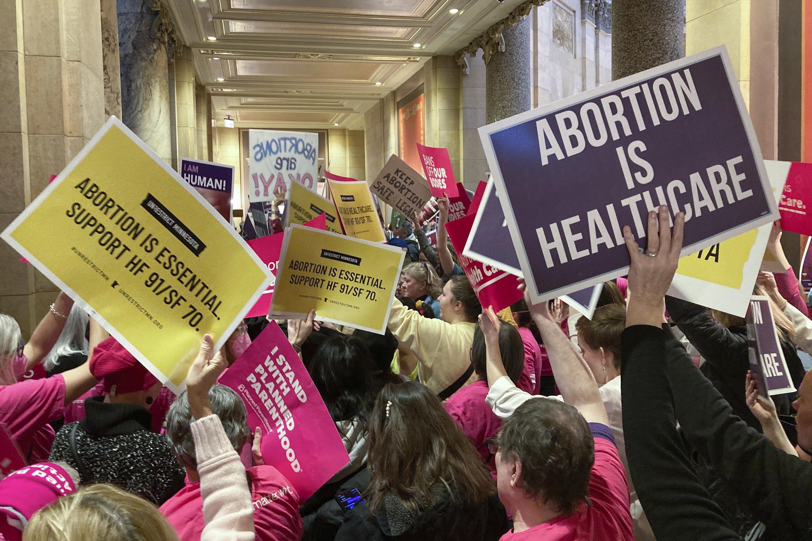 Abortion protesters on both sides of the issue pack the halls outside the Minnesota Senate chamber in January 2023 (AP Photo/Steve Karnowski)