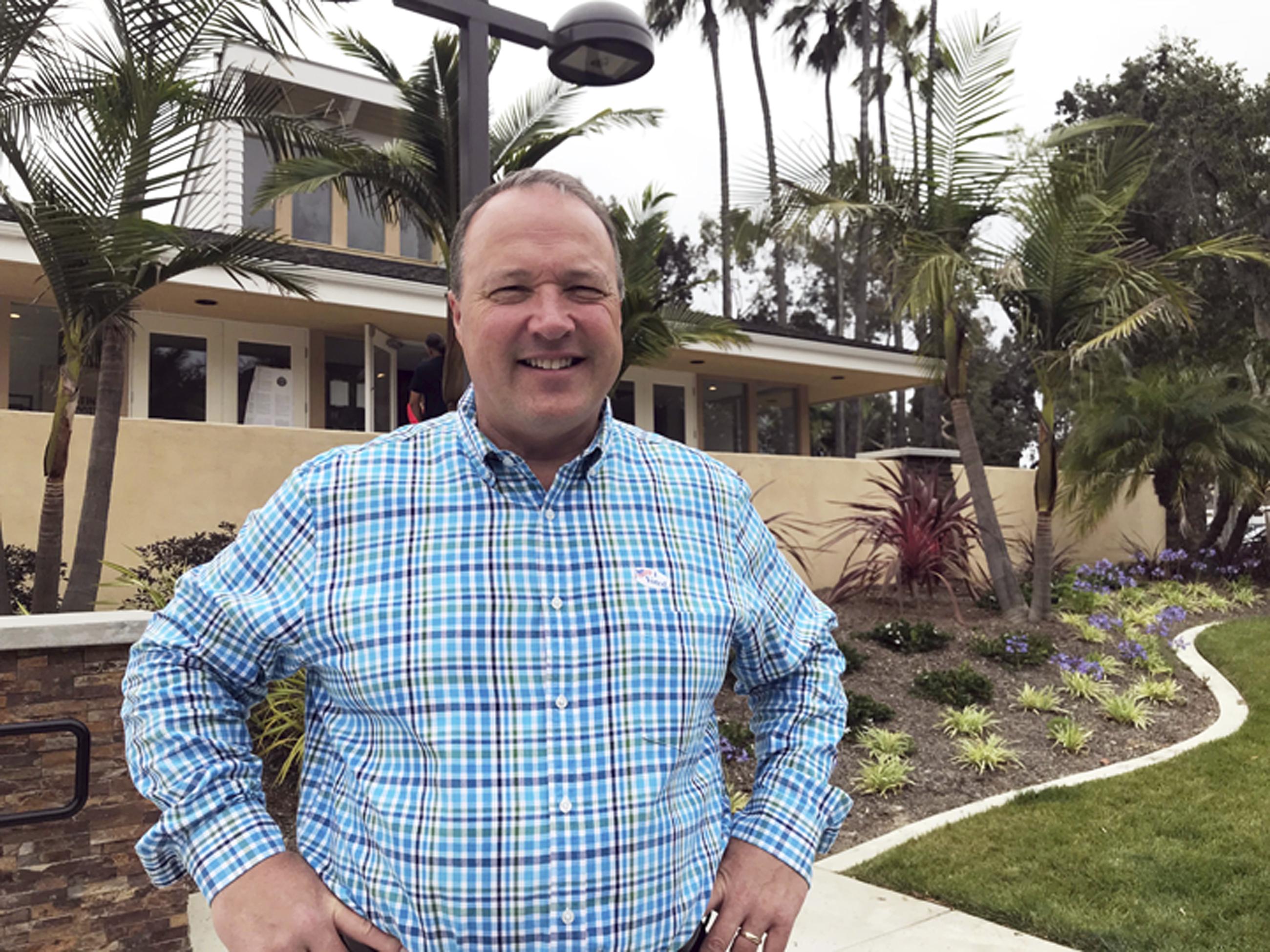 -FILE - Scott Baugh, a Republican candidate for Congress from Orange County's 48th District, poses outside a polling place after voting in Huntington Beach, Calif., June 5, 2018. (AP Photo/Krysta Fauria, File)