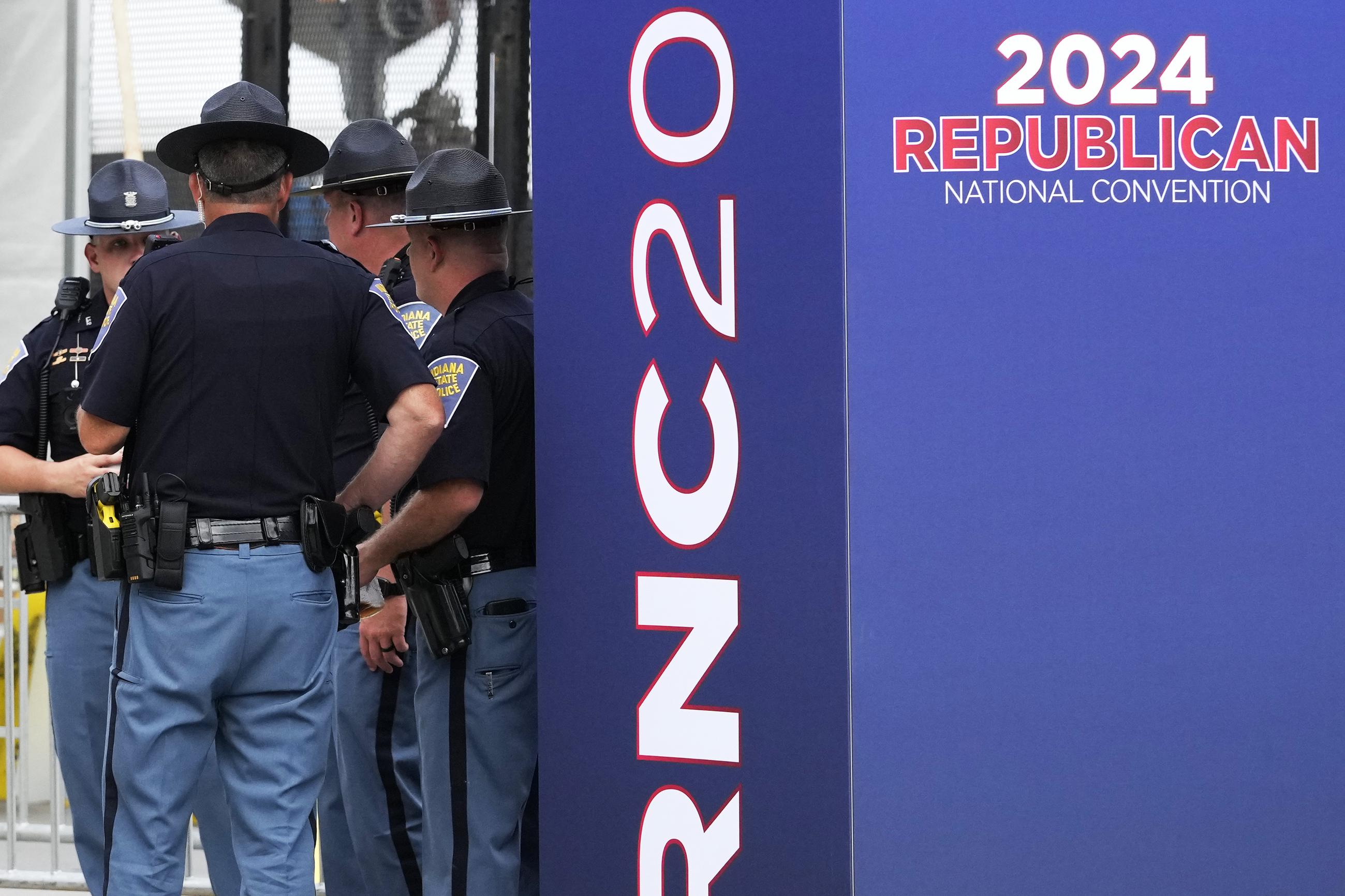 Indiana State Police stand outside the Fiserv Forum during preparations for the Republican National Convention in Milwaukee. (AP Photo/Nam Y. Huh)