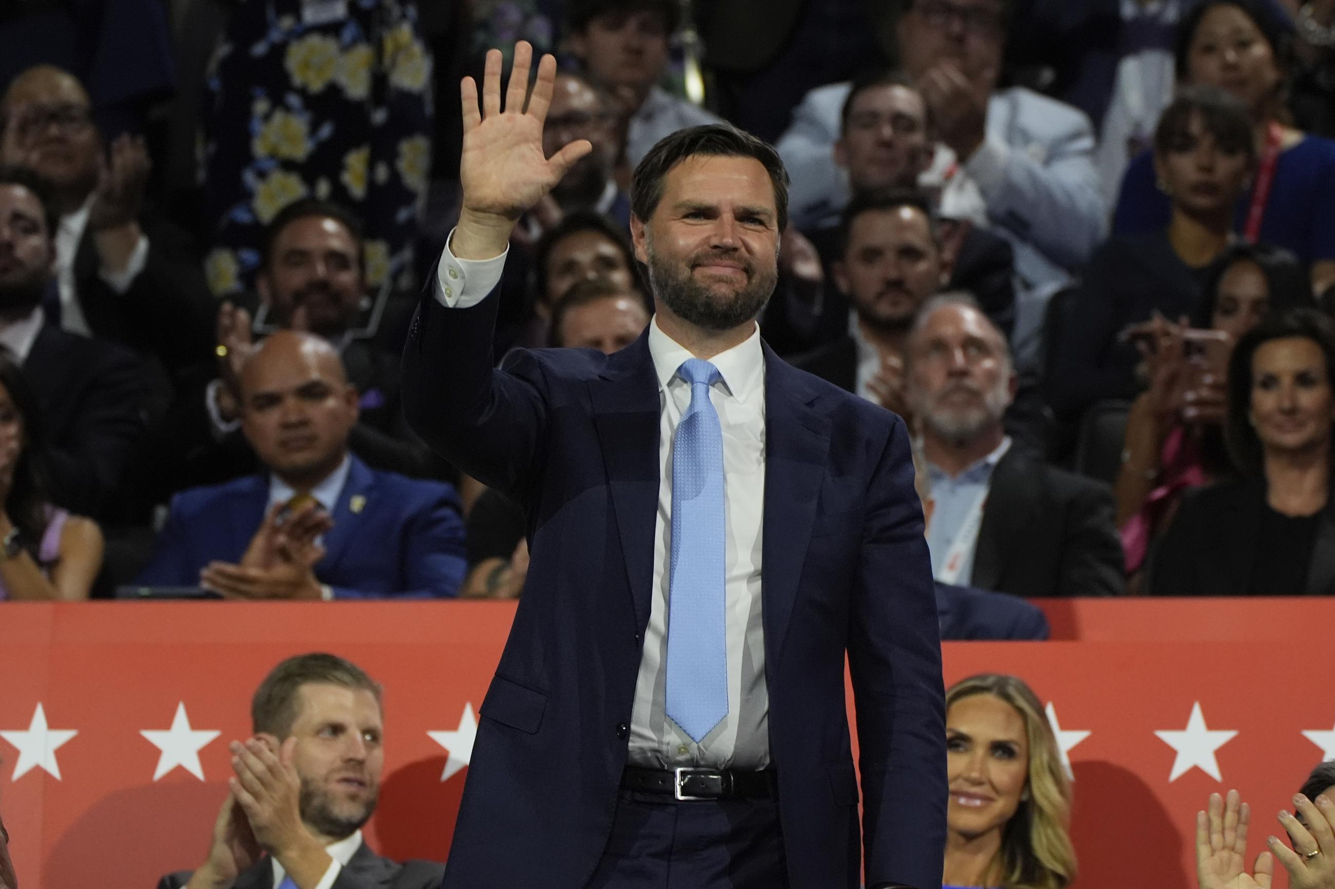 Republican vice presidential candidate J.D. Vance waves during the Republican National Convention Monday in Milwaukee. (AP Photo/Paul Sancya)
