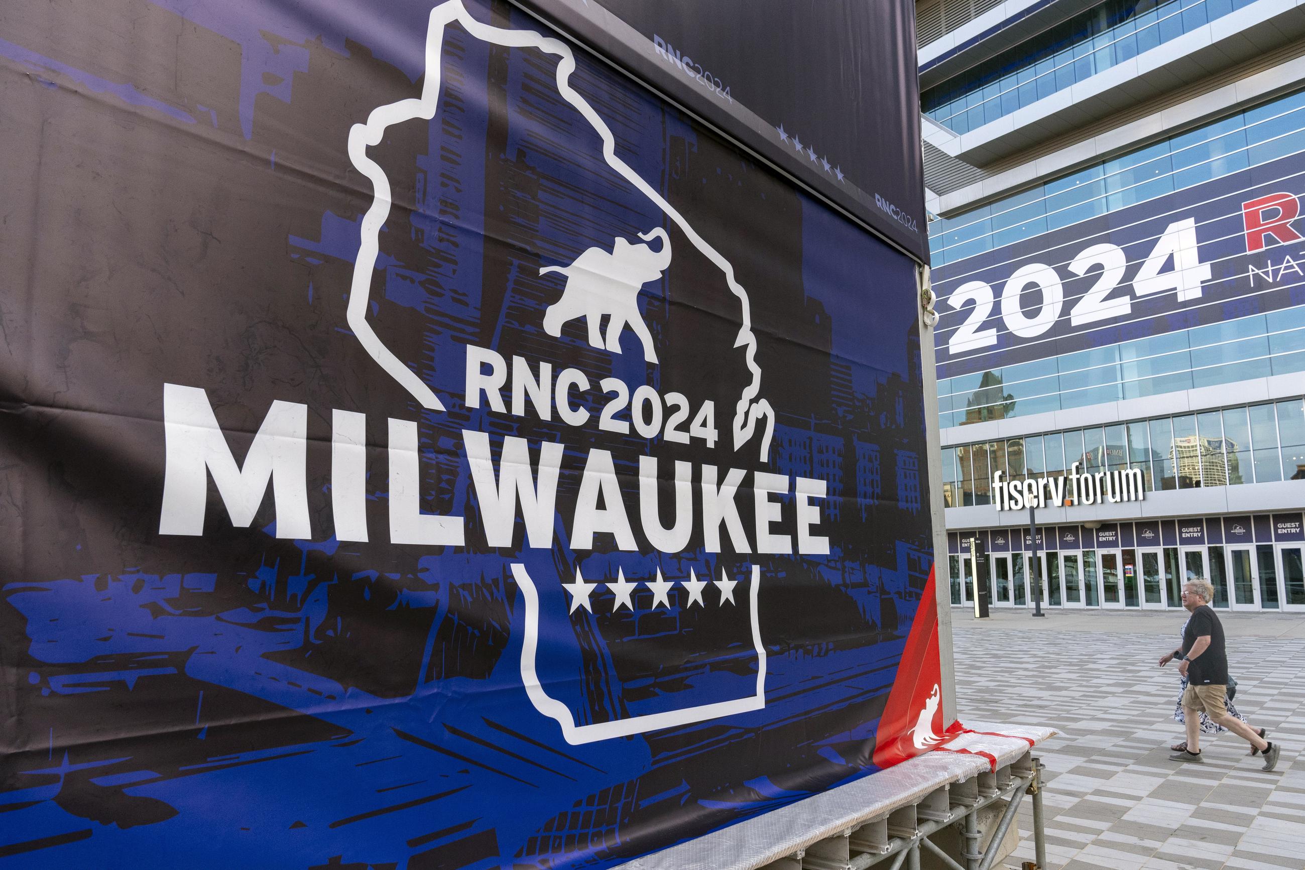 FILE - People walk past the Fiserv Forum ahead of the 2024 Republican National Convention Thursday in Milwaukee. (AP Photo/Alex Brandon)