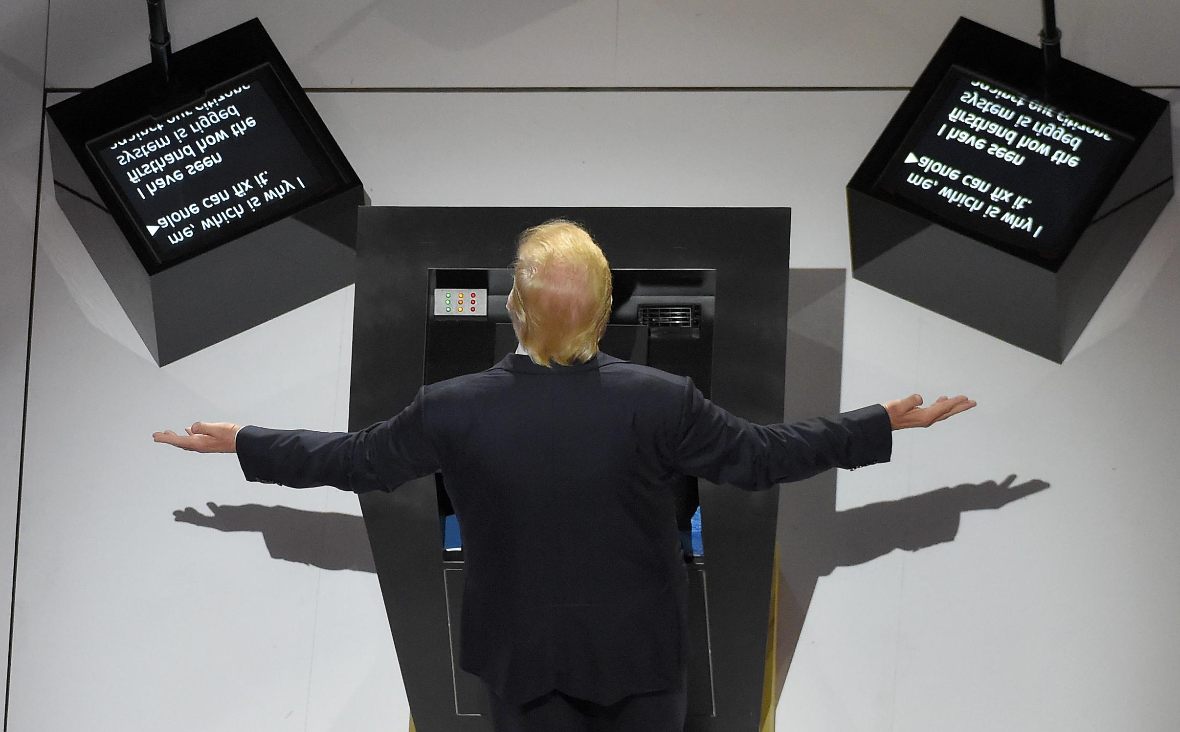 Donald Trump giving his acceptance speech at the 2016 Republican National Convention in front of teleprompters that read in part, "... which is why I alone can fix it. I have seen firsthand how the system is rigged. ..." (AP Photo/Mark J. Terrill)