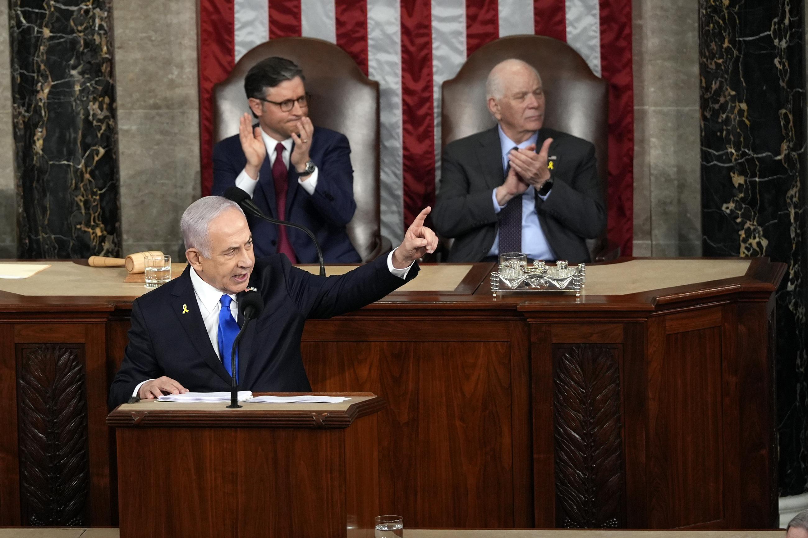 Israeli Prime Minister Benjamin Netanyahu speaks to a joint meeting of Congress on Wednesday, as House Speaker Mike Johnson and Senate Foreign Relations Chair Ben Cardin look on. (AP Photo/Julia Nikhinson)