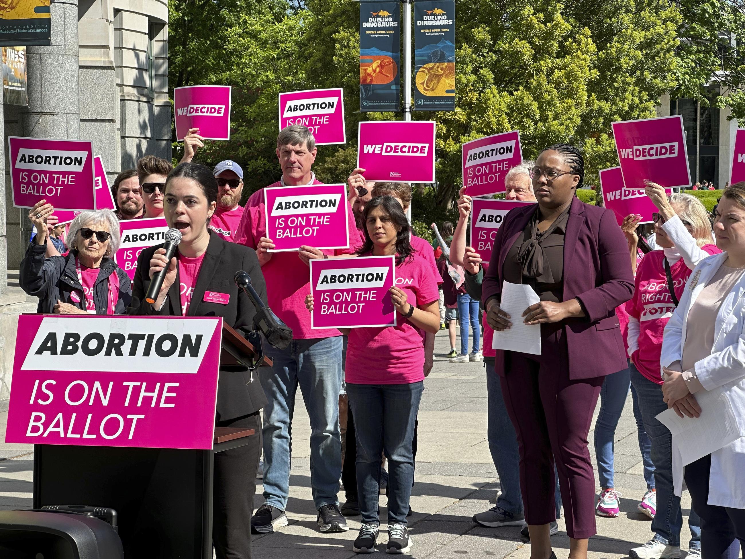 Planned Parenthood's Emma Horst-Martz discusses the groups' canvassing goal of knocking on 1 million doors during a press conference at Bicentennial Plaza in Raleigh, N.C., on April 25. (AP Photo/Makiya Seminera, File)
