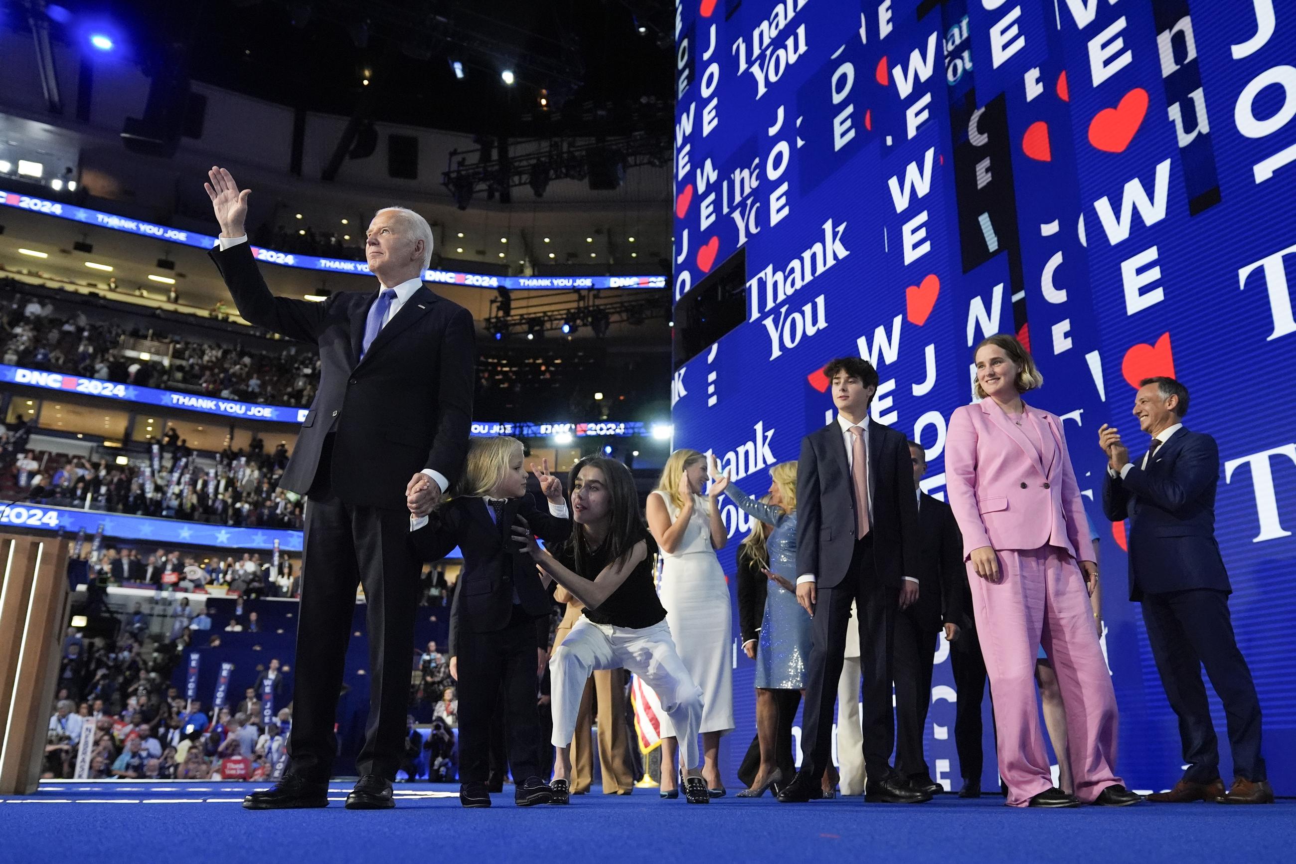 President Biden waves during the Democratic National Convention in Chicago on Monday. (AP Photo/Stephanie Scarbrough)