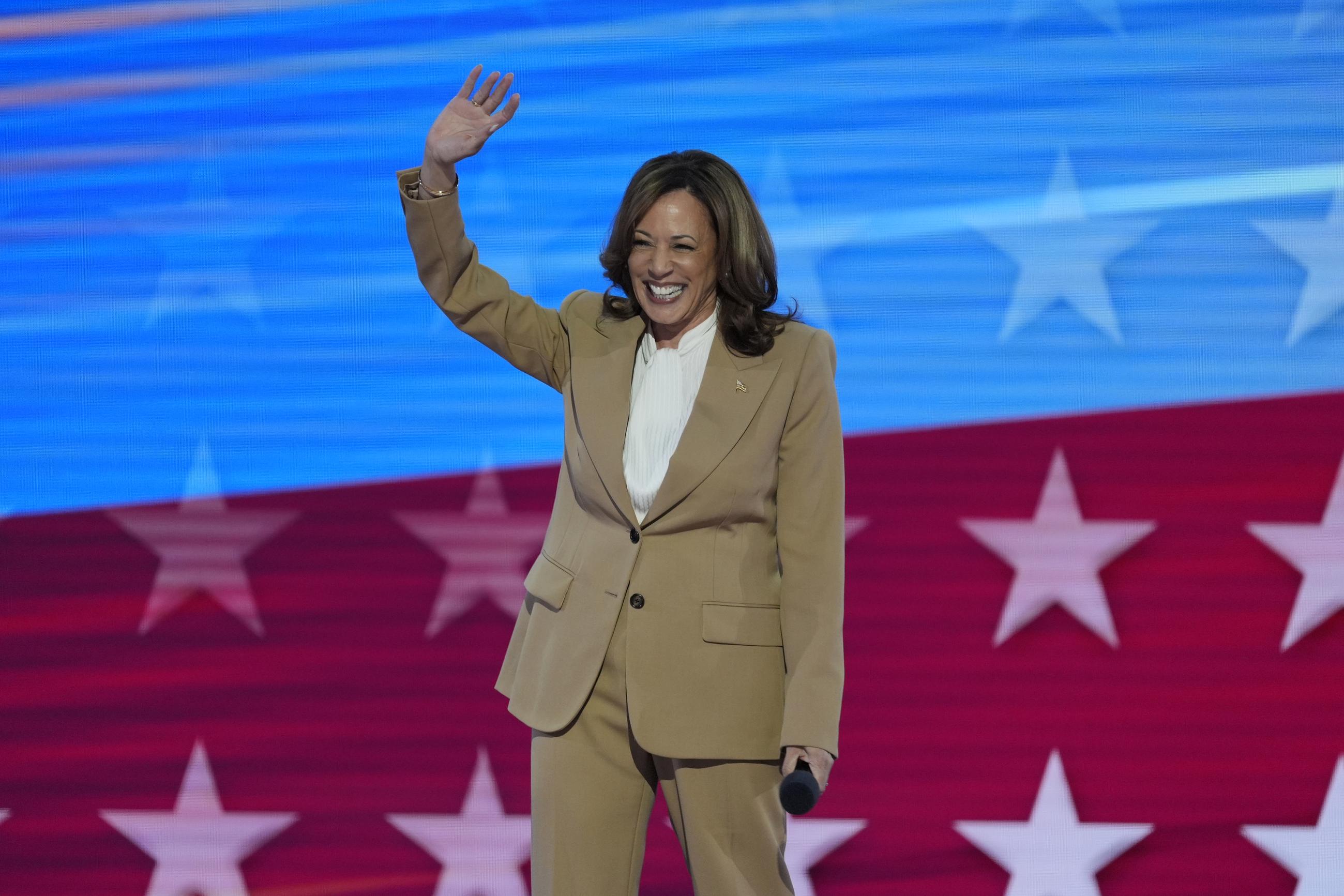 Vice President Kamala Harris waves to supporters during the Democratic National Convention on Monday. (AP Photo/J. Scott Applewhite)
