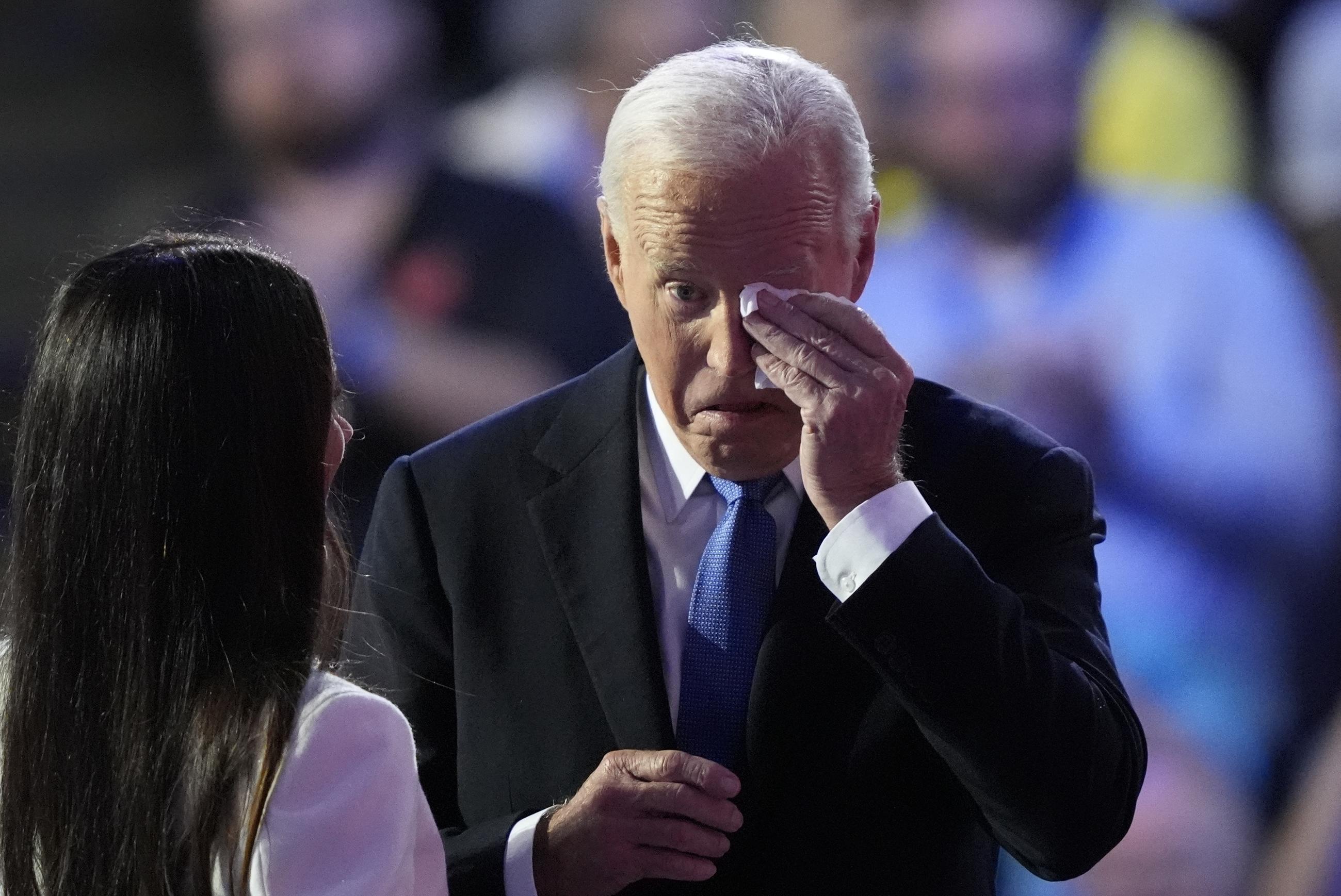President Biden wipes a tear during the Democratic National Convention on Monday. (AP Photo/Charles Rex Arbogast)
