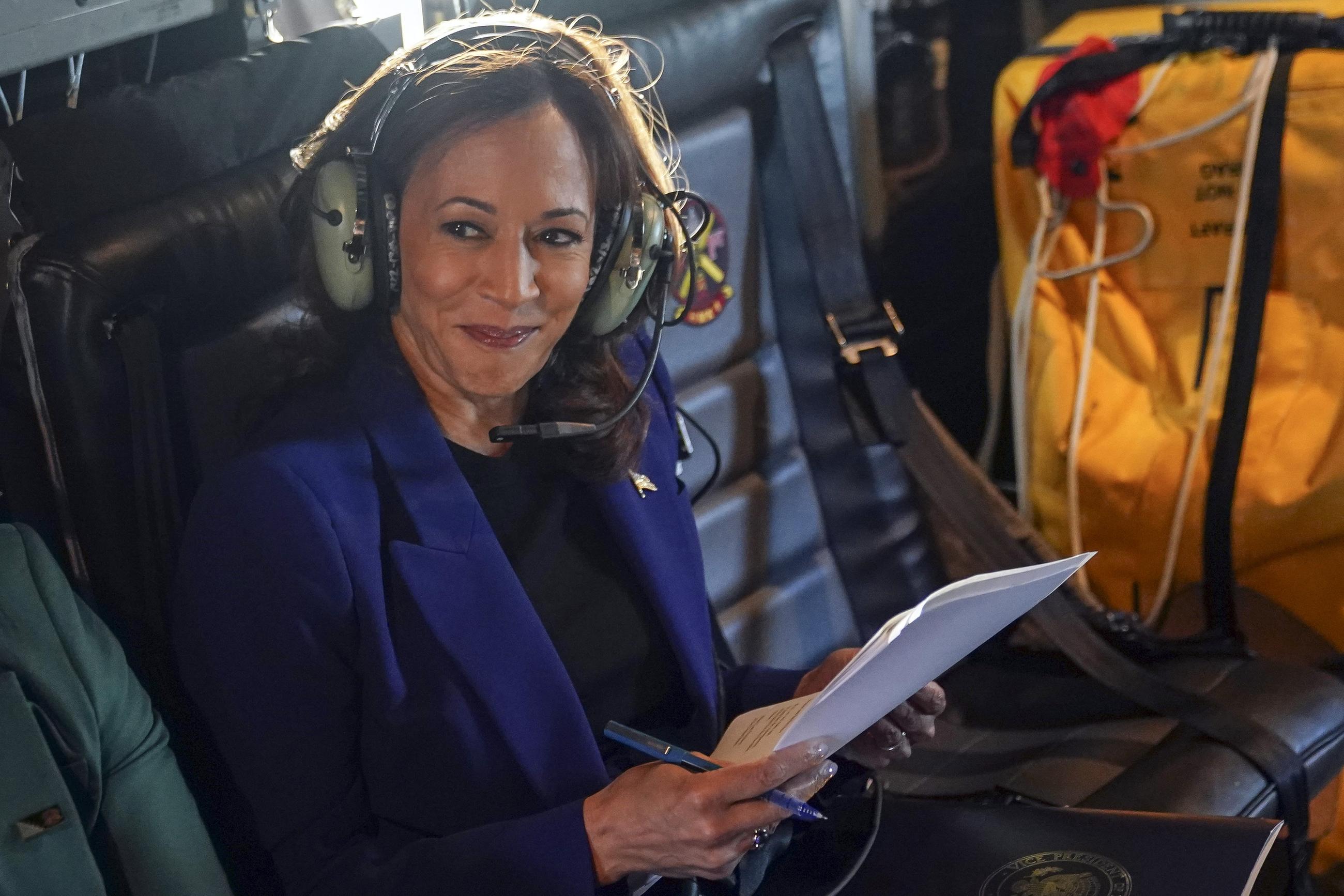 Democratic presidential nominee Kamala Harris works while flying on Marine Two en route to Chicago O'Hare International Airport on Tuesday. (Kevin Lamarque/Pool via AP)