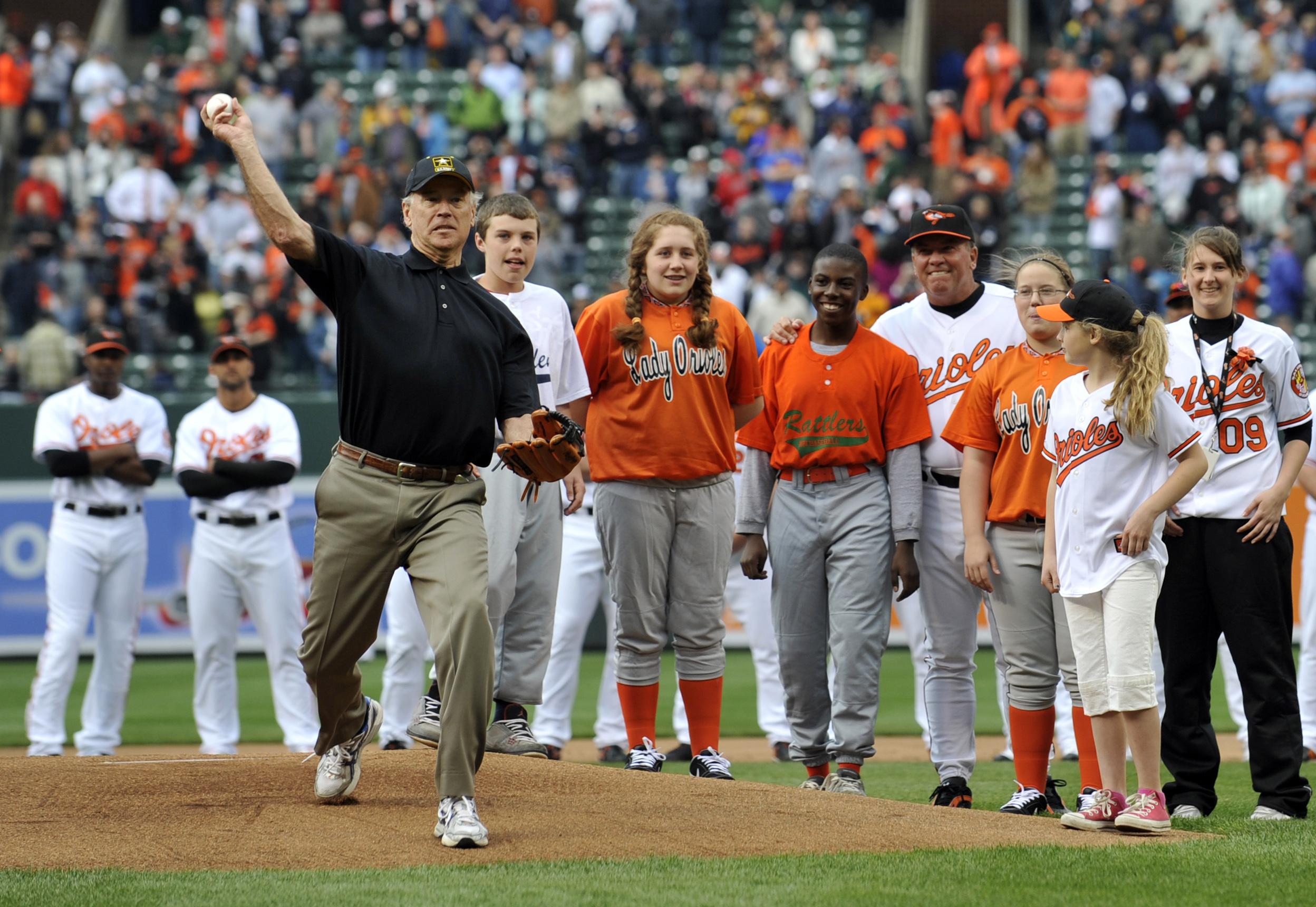 In this April 6, 2009, file photo, Vice President Joe Biden throws out the first pitch prior to the Baltimore Orioles and the New York Yankees opening day baseball game at Camden Yards in Baltimore. (AP Photo/Gail Burton, File)