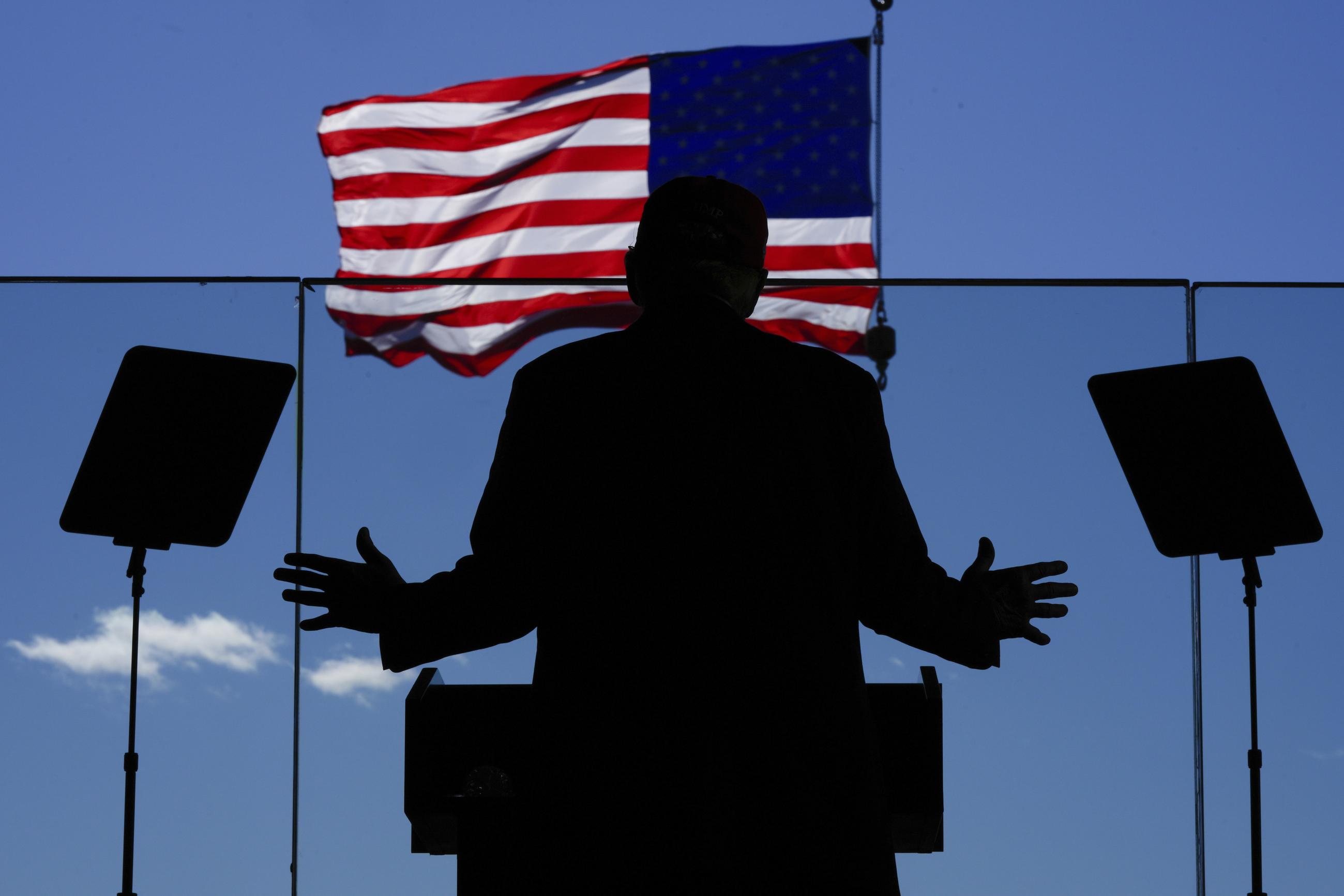 Former President Trump speaks during a campaign rally at Dodge County Airport in Juneau, Wis., on Oct. 6. (AP Photo/Julia Demaree Nikhinson)