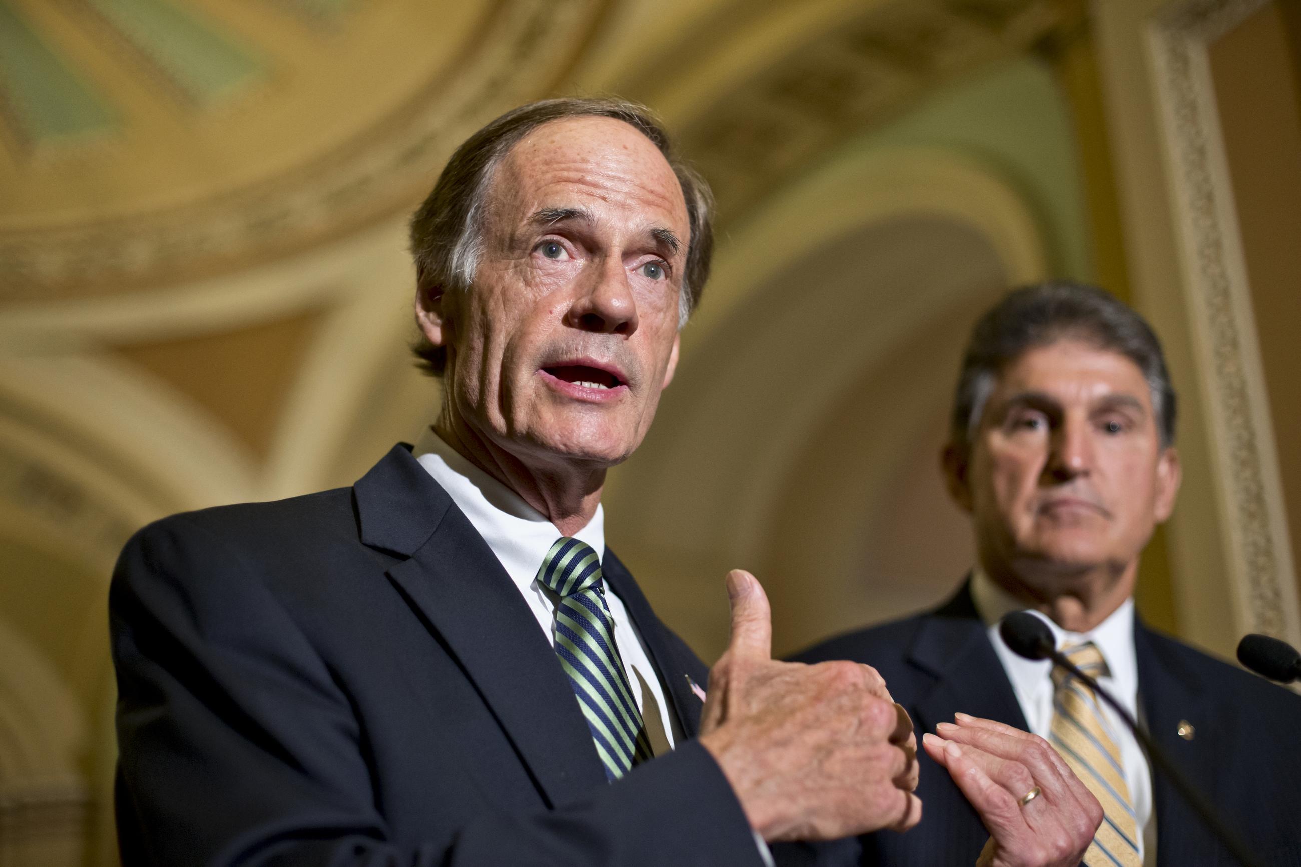 Sens. Tom Carper and Joe Manchin (AP Photo/J. Scott Applewhite)