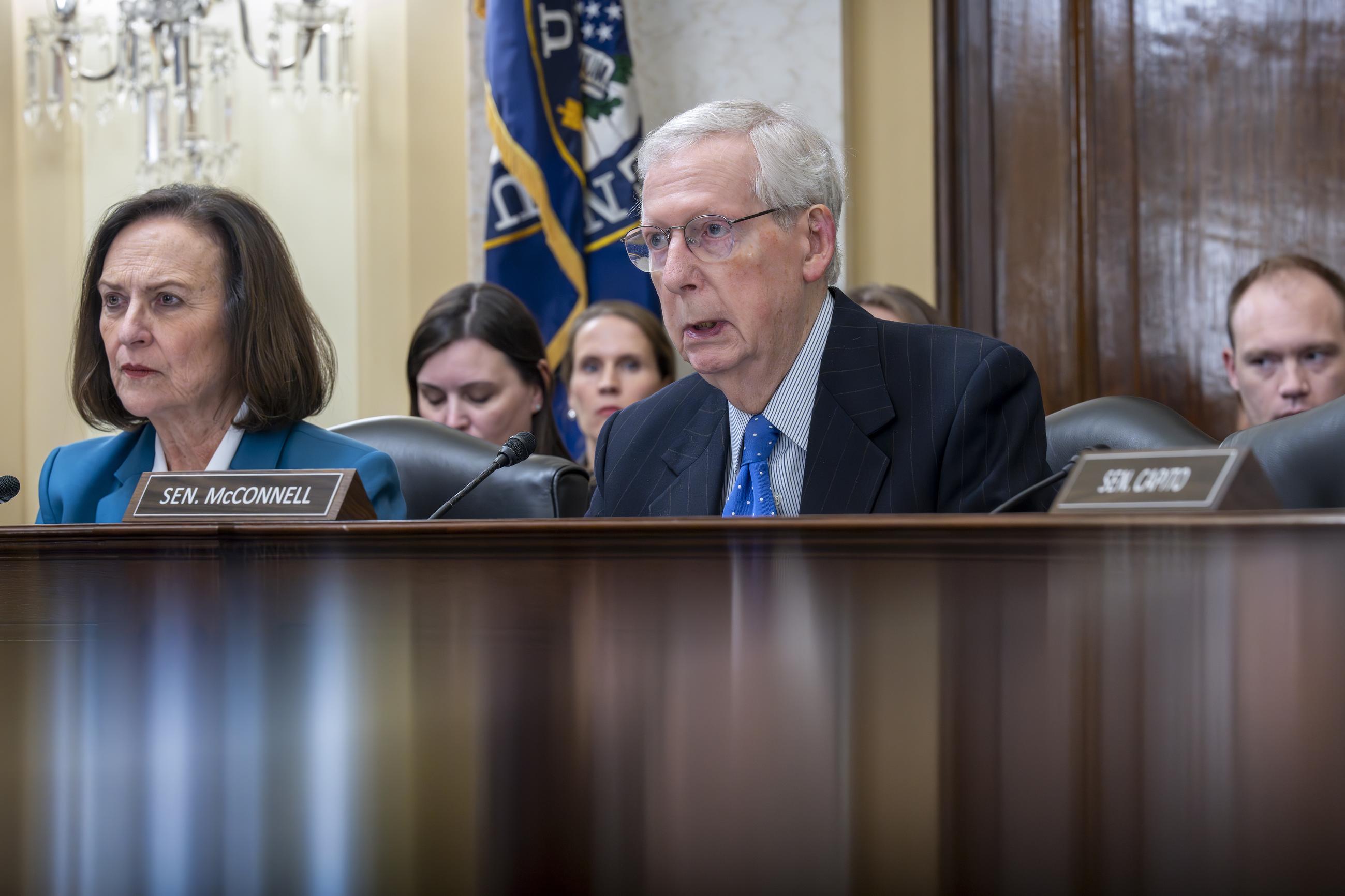 Senate Minority Leader Mitch McConnell, R-Ky., joined at left by Sen. Deb Fischer, R-Neb., the ranking member of the Senate Rules Committee, makes a statement as the panel holds a vote to move toward circumventing the months-long blockade of military promotions by Sen. Tommy Tuberville, R-Ala., at the Capitol in Washington, Tuesday, Nov. 14, 2023. (AP Photo/J. Scott Applewhite)