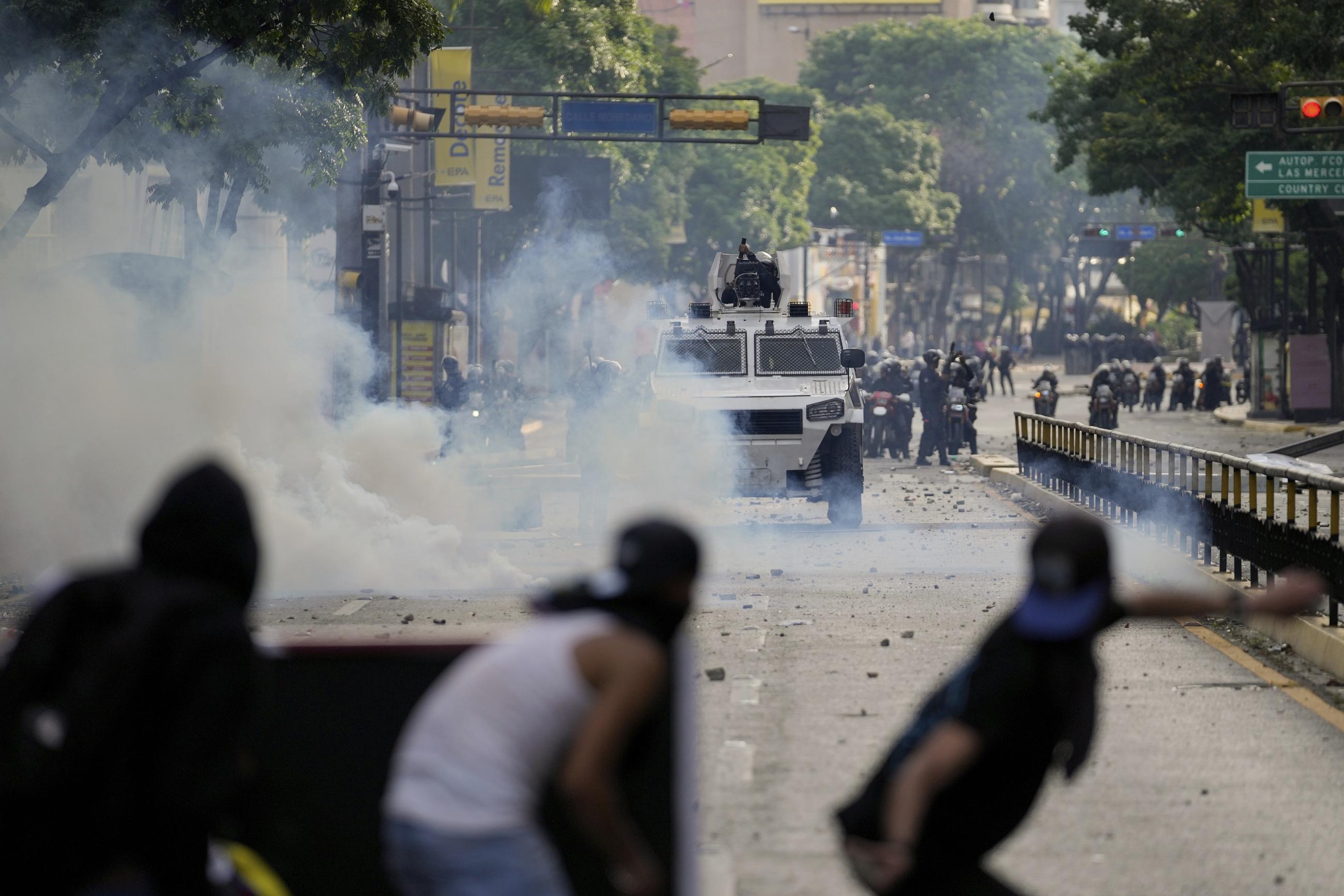 Protesters clash with police n Caracas, Venezuela, on July 29, during demonstrations against the official election results declaring President Nicolás Maduro's reelection. (AP Photo/Matias Delacroix, File)