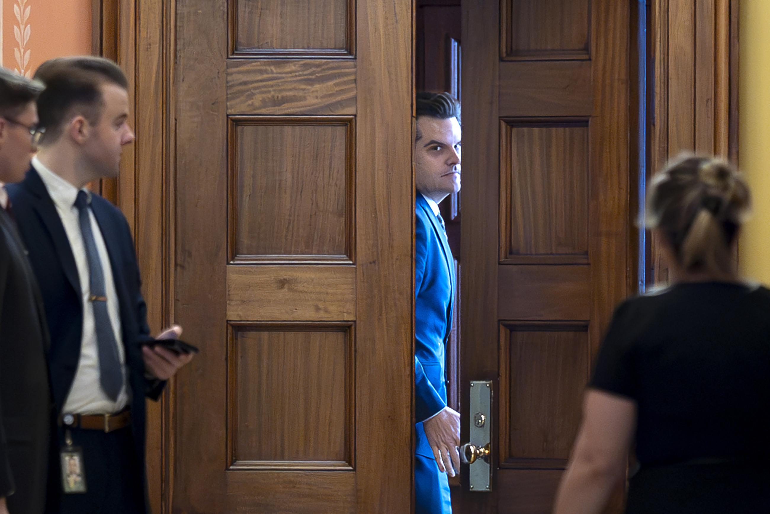 Former Rep. Matt Gaetz closes a door to a private meeting with Vice President-elect J.D. Vance and Republican Senate Judiciary Committee members at the Capitol on Wednesday. (AP Photo/J. Scott Applewhite)