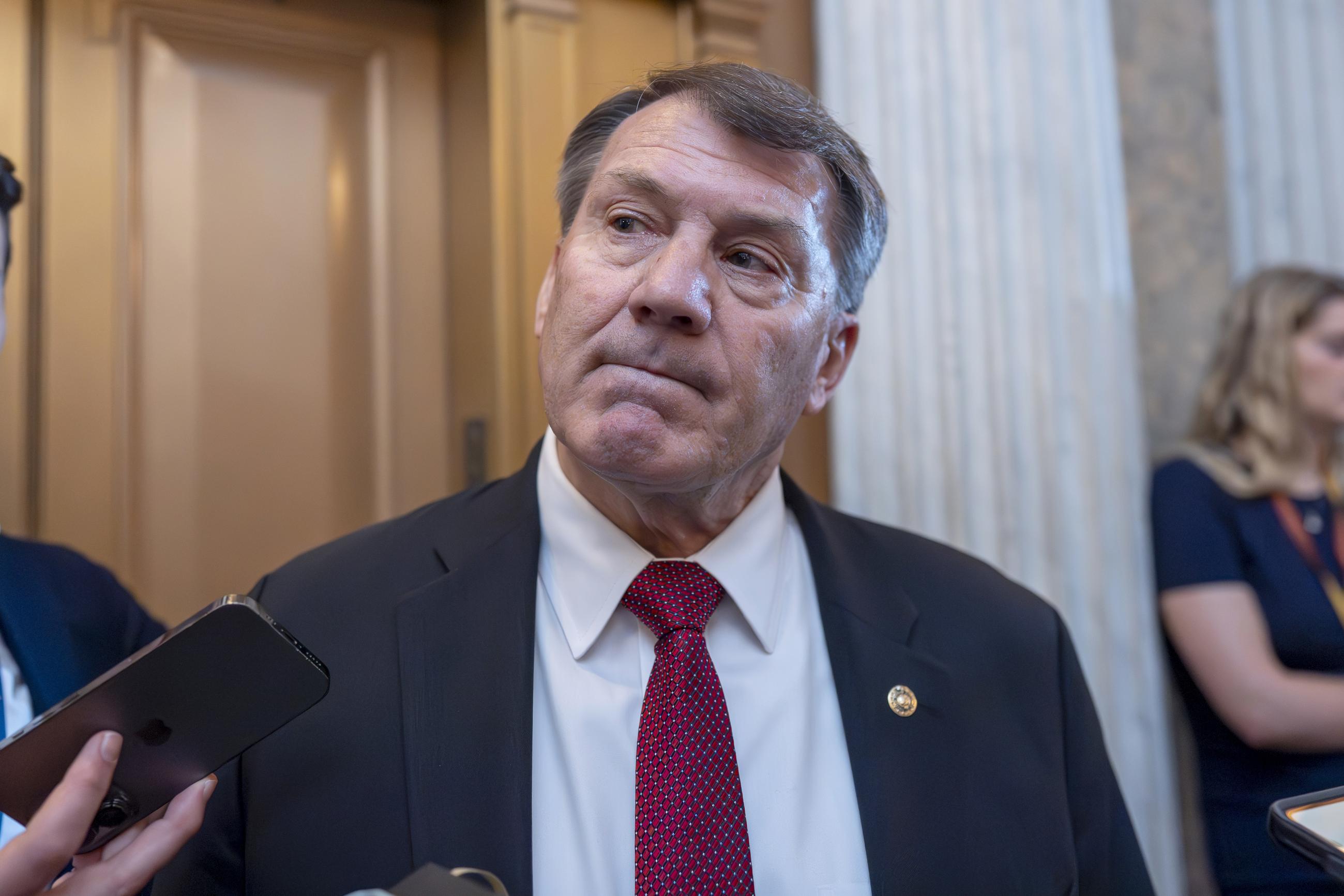 FILE - Sen. Mike Rounds, R-S.D., talks to reporters at the Capitol in Washington, April 23, 2024. (AP Photo/J. Scott Applewhite, File)