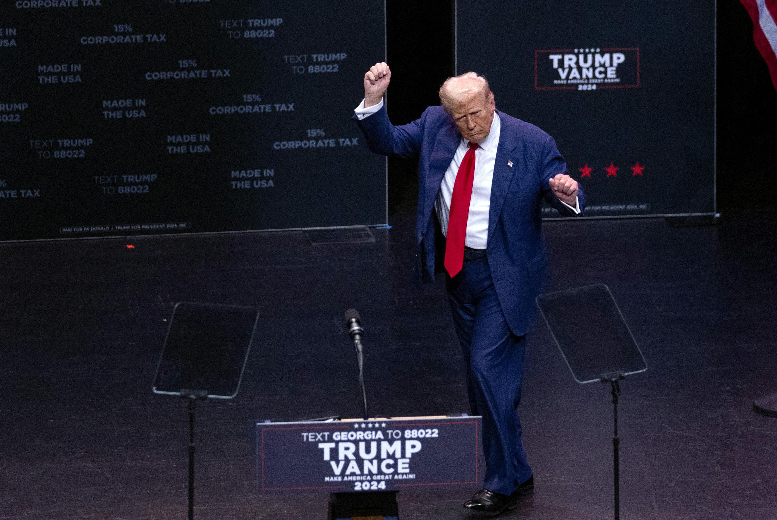 Donald Trump dancing at a campaign rally in Georgia in September (AP Photo/John Bazemore)