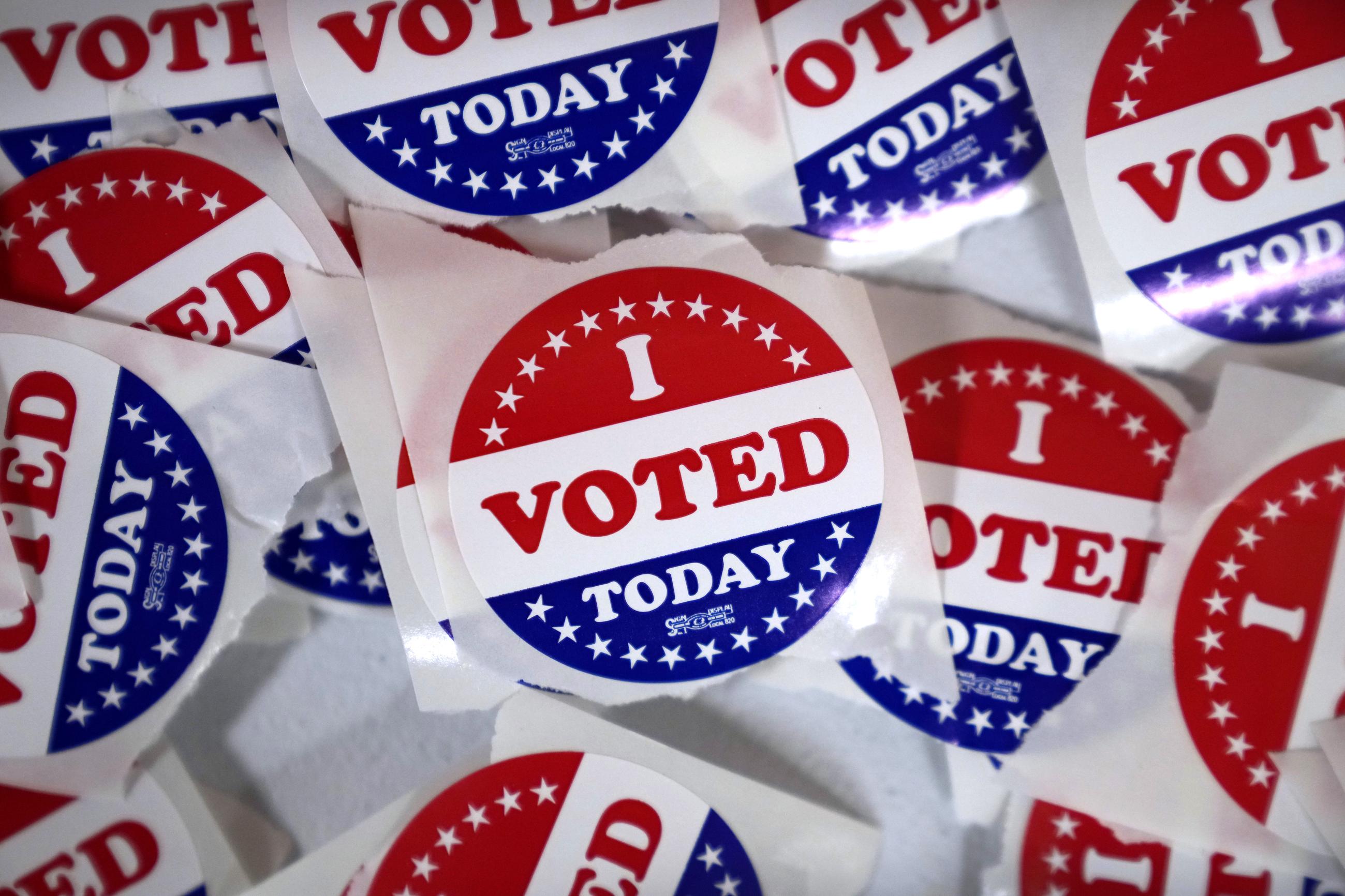 FILE - "I voted" stickers are seen in the Polk County Election Office during early voting, Wednesday, Oct. 16, 2024, in Des Moines, Iowa. (AP Photo/Charlie Neibergall, File)