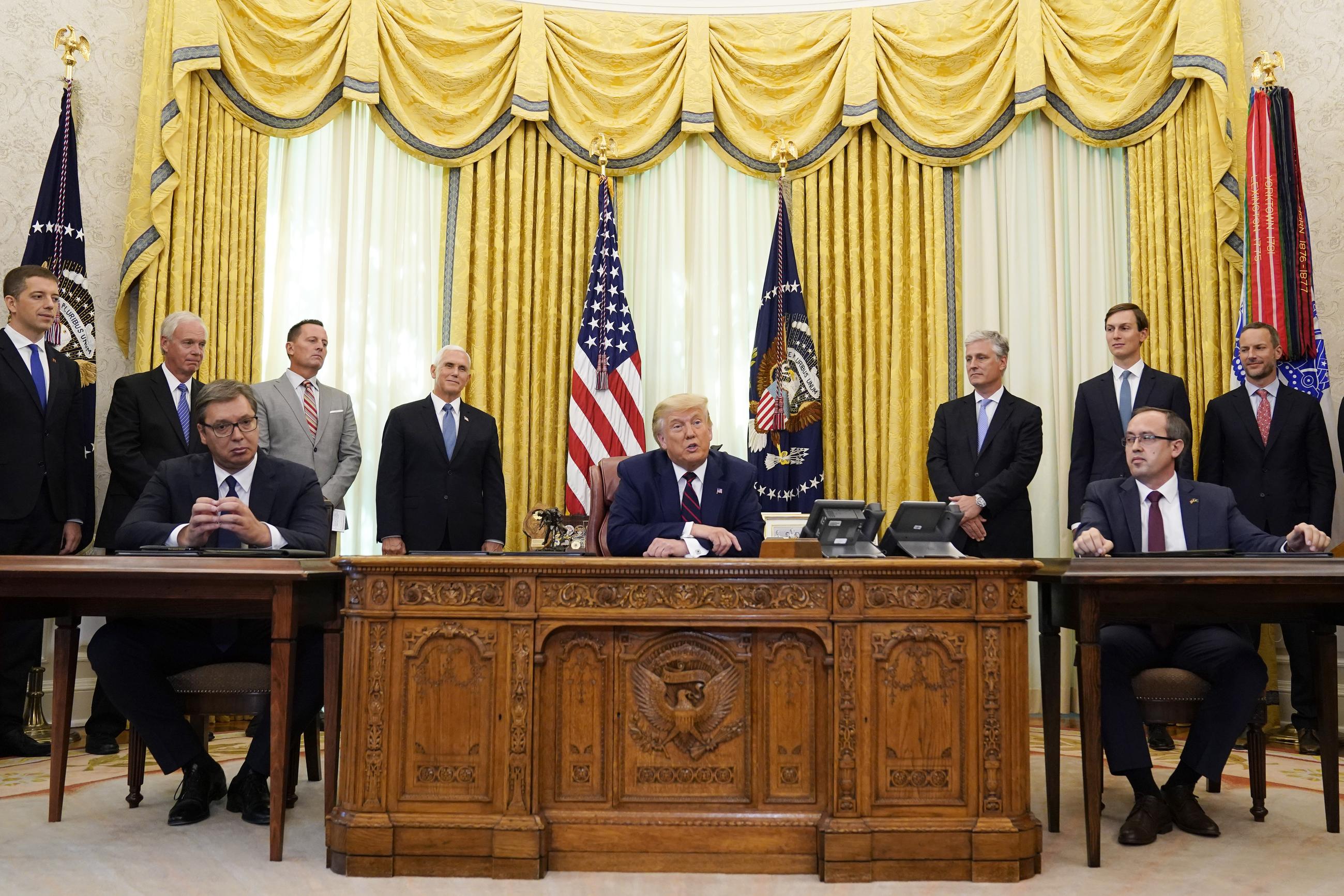 President Trump speaks after participating in a signing ceremony with Serbian President Aleksandar Vucic (seated left), and Kosovar Prime Minister Avdullah Hoti (seated right), in the Oval Office on Sept. 4, 2020. (AP Photo/Evan Vucci)