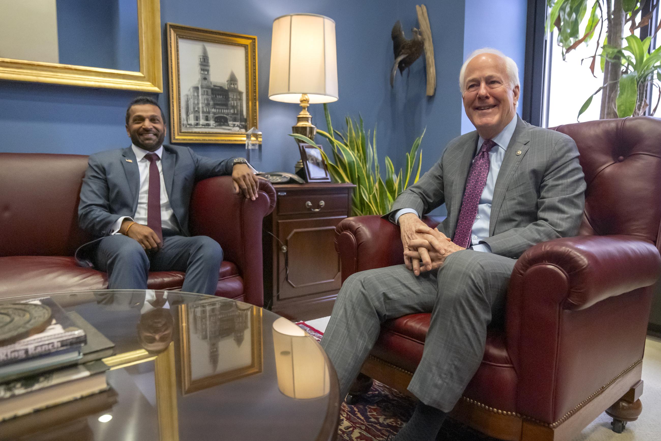 Kash Patel, President-elect Trump's pick to be the director of the FBI, meets with Sen. John Cornyn in Cornyn's office on Capitol Hill Monday. (AP Photo/Mark Schiefelbein)