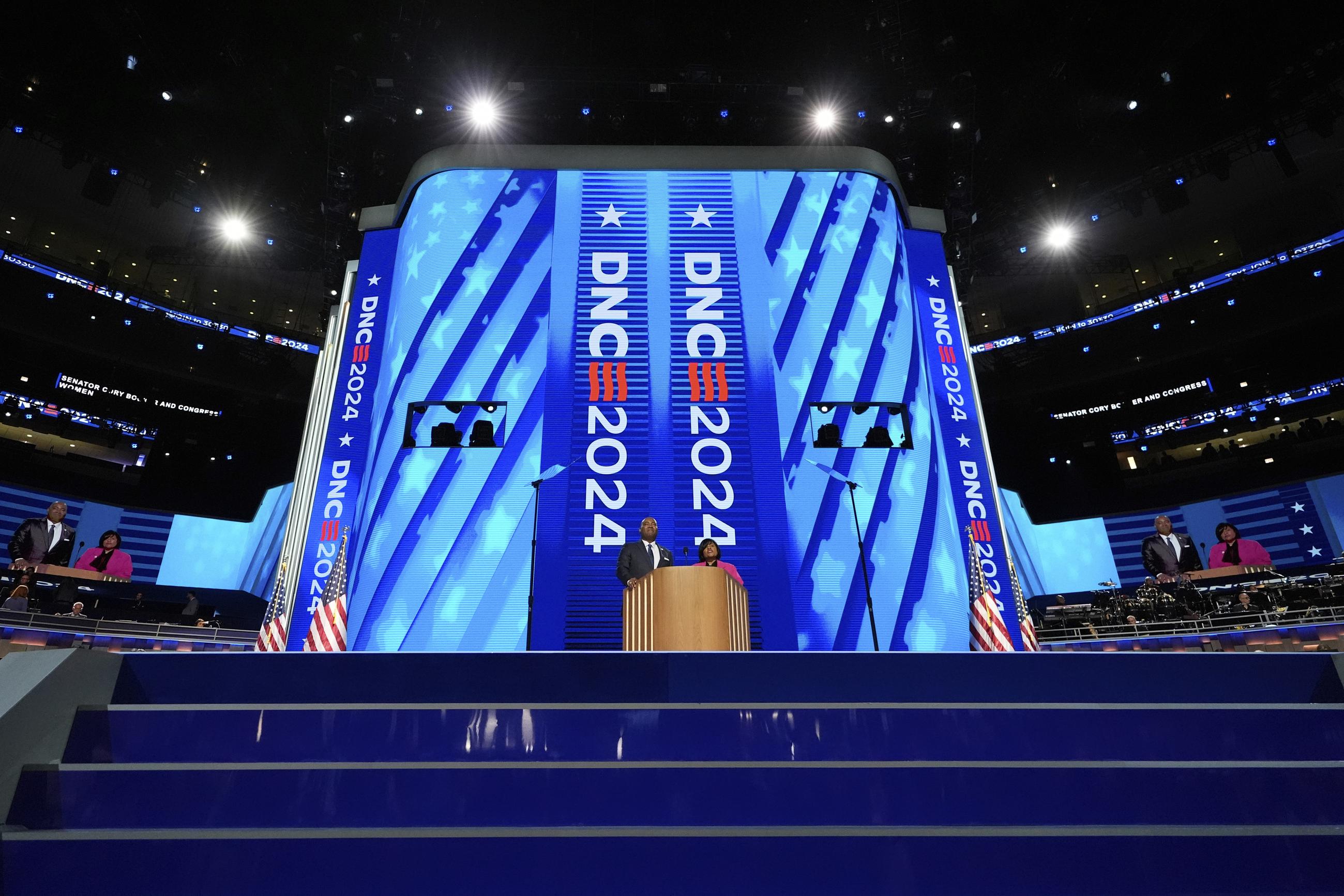 Jaime Harrison, chair of the Democratic National Committee, left, and Minyon Moore, chair of the 2024 Democratic National Convention Committee, speak during the Democratic National Convention in August. (AP Photo/Brynn Anderson)