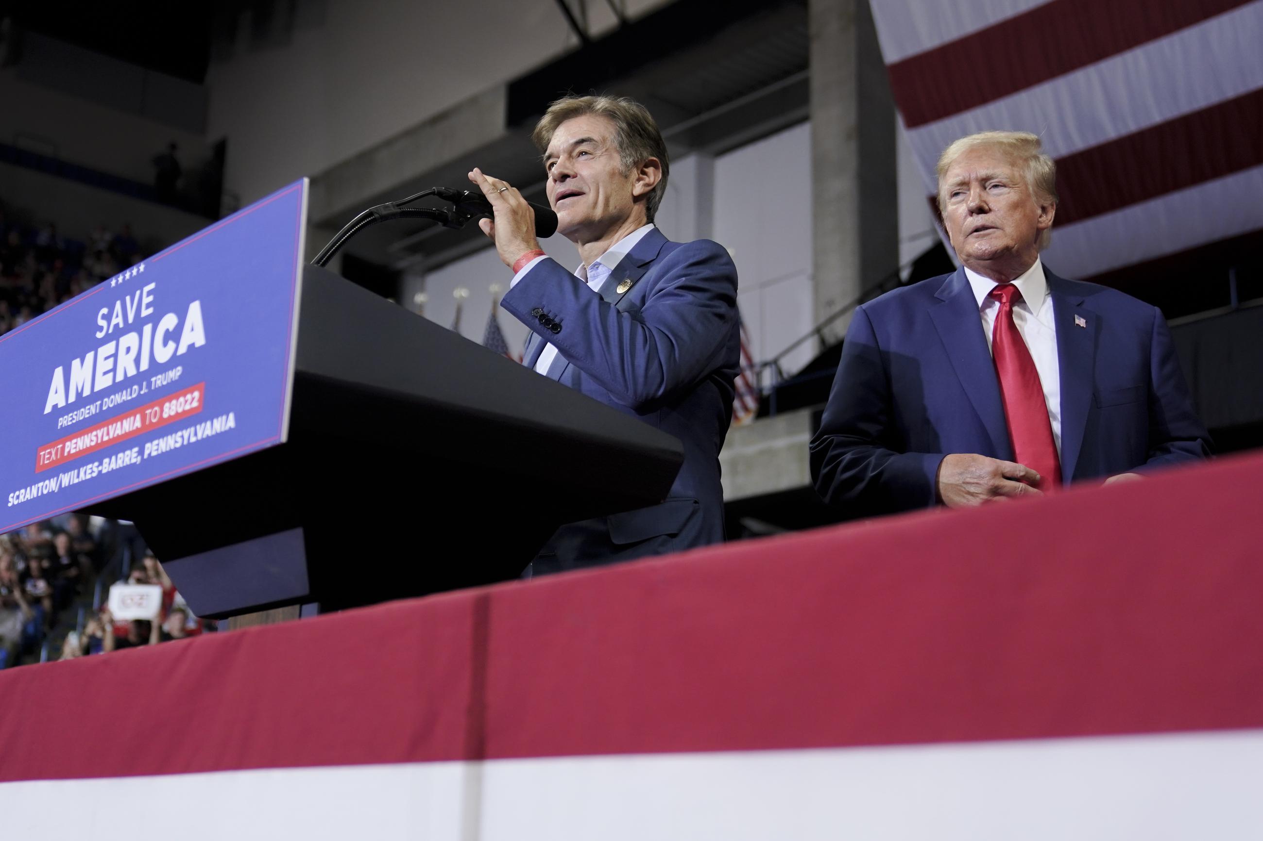 Then-Pennsylvania Republican Senate candidate Mehmet Oz, left, is joined by former President Trump at a rally in September 2022. Trump has selected Oz to head the Centers for Medicare and Medicaid Services. (AP Photo/Mary Altaffer)
