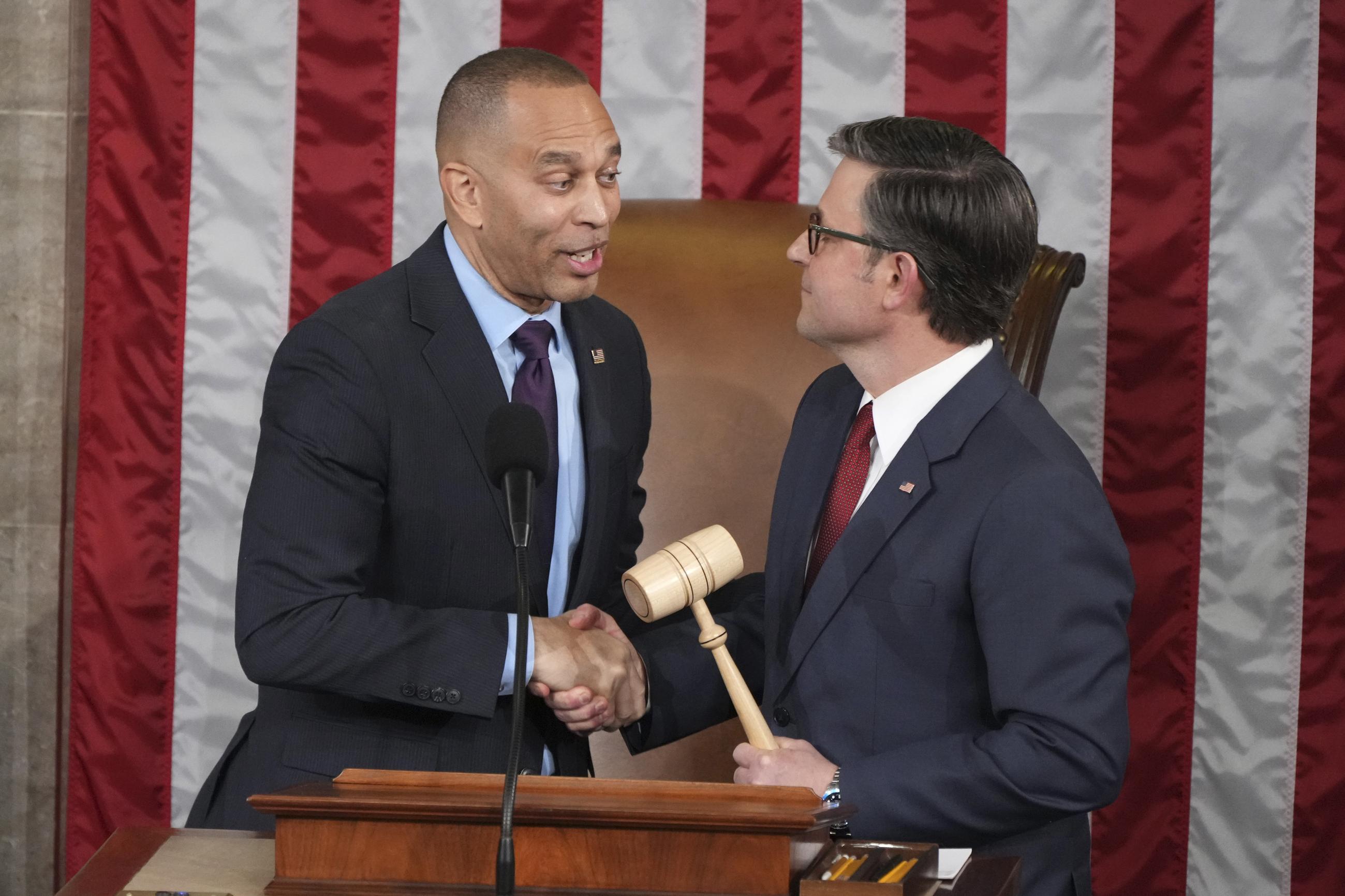 House Minority Leader Hakeem Jeffries shakes hands after giving the gavel to House Speaker Mike Johnson in a customary nod to the peaceful transfer of power as the House of Representatives meets to elect a speaker and convene the new 119th Congress on Friday. (AP Photo/Jacquelyn Martin)