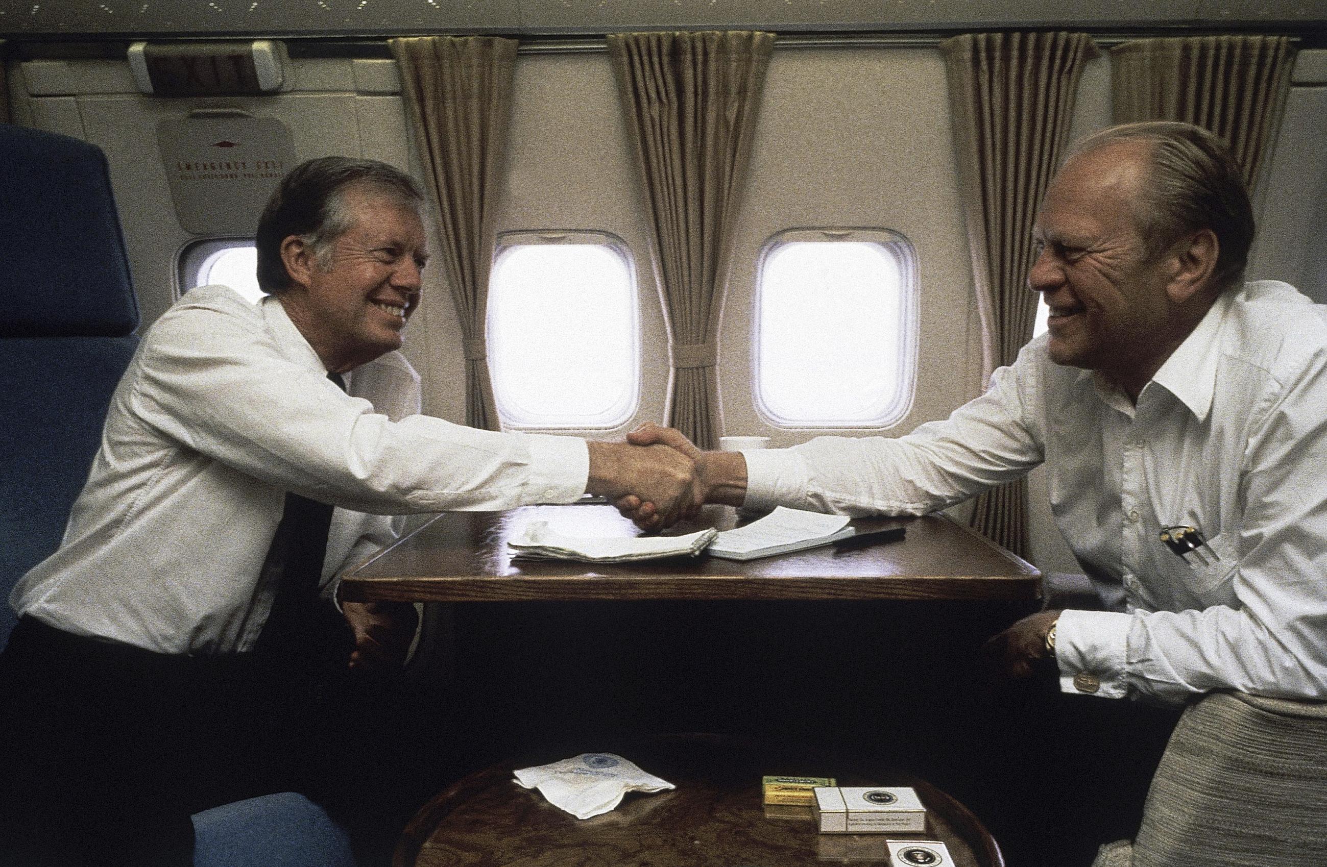 Jimmy Carter and Gerald Ford aboard Air Force One between Cairo and Spain on Oct. 10, 1981