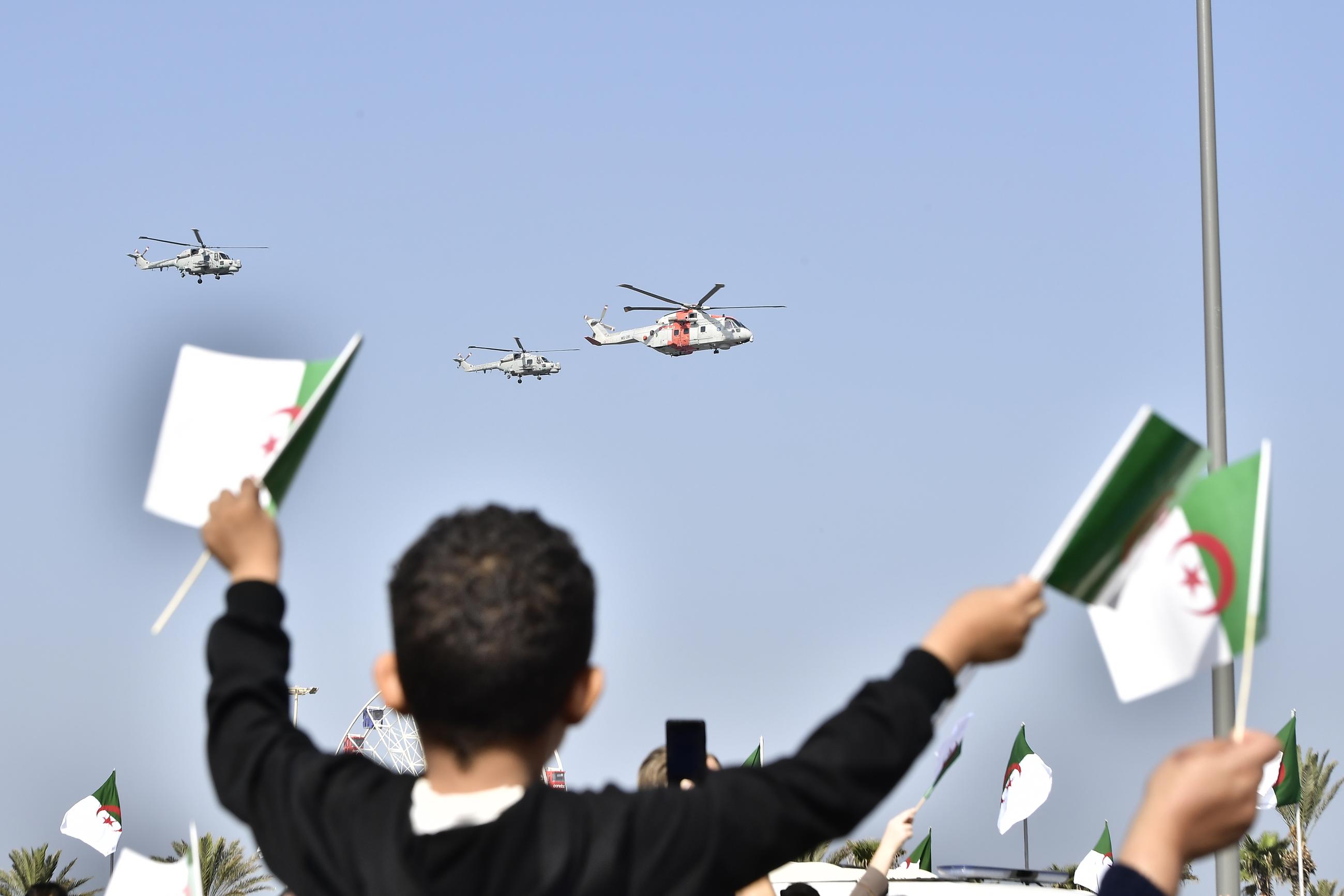 Algerians watch a military parade to mark the 70th anniversary of the country's war for independence from France in Algiers on Nov. 1. (AP Photo/Fateh Guidoum)