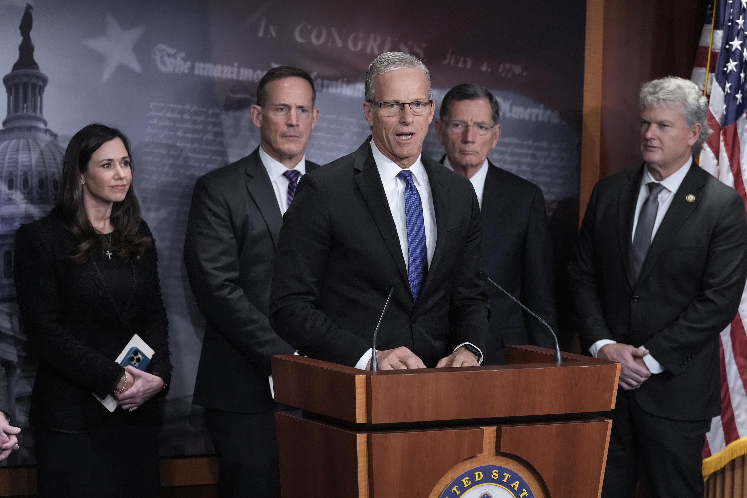 Senate Majority Leader John Thune, joined from left by Sens. Katie Britt and Ted Budd, Majority Whip John Barrasso, and Rep. Mike Collins, speaks to reporters about the Laken Riley Act at the Capitol last week. (AP Photo/J. Scott Applewhite)