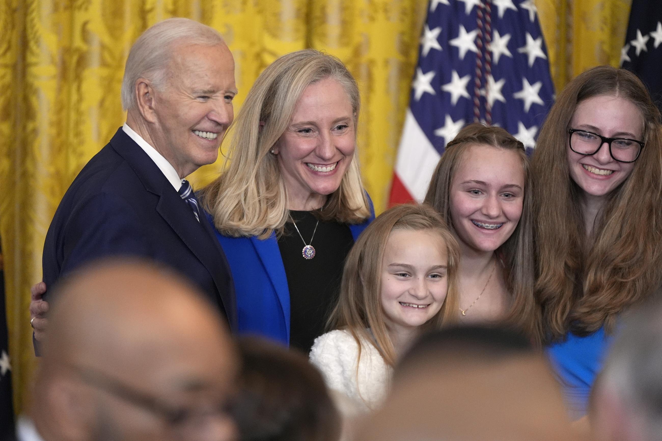 President Joe Biden, from left, poses for a photo with former Rep. Abigail Spanberger, D-Va., and her children after signing the Social Security Fairness Act during a ceremony in the East Room of the White House, Sunday, Jan. 5, 2025, in Washington. (AP Photo/Manuel Balce Ceneta)