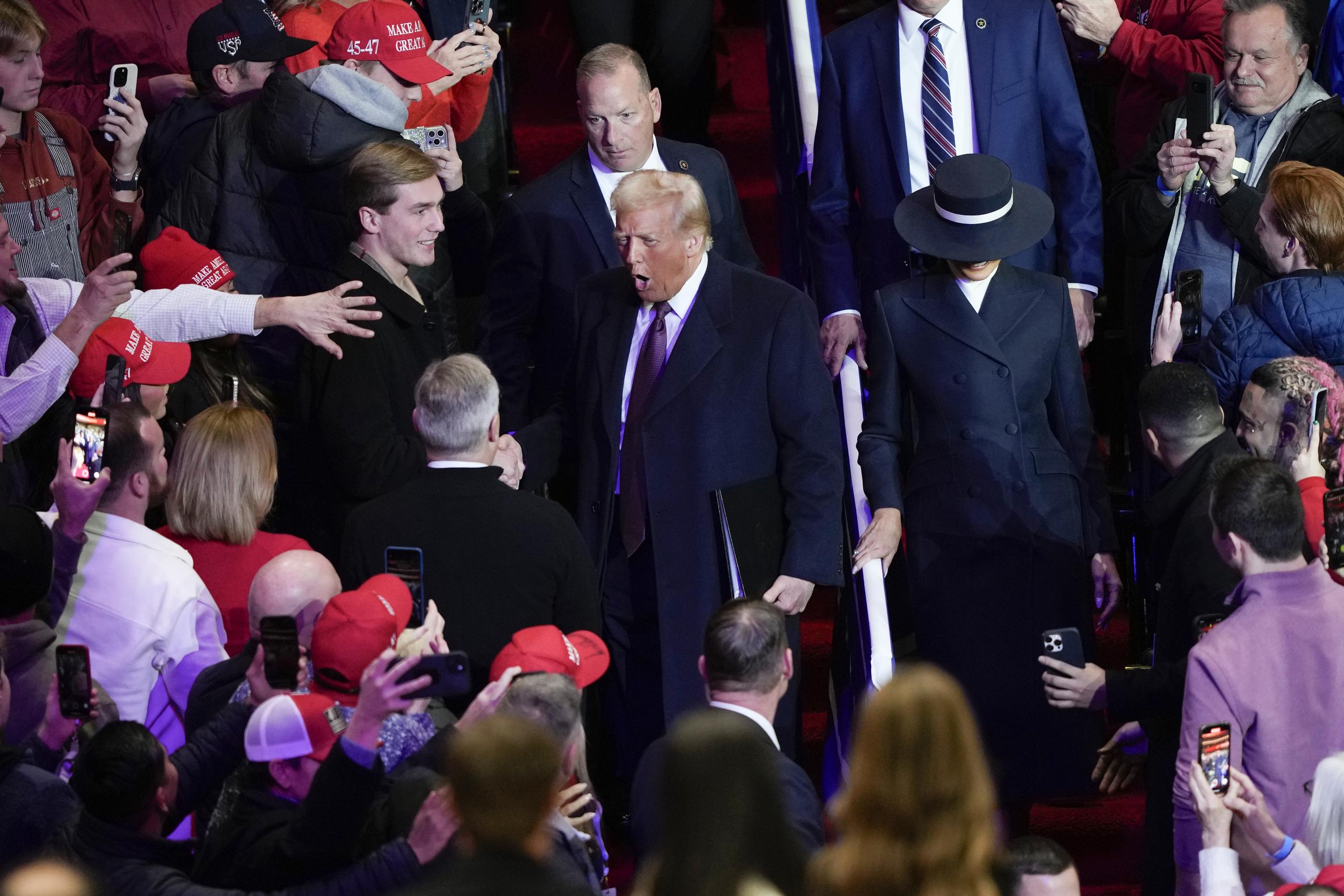 President Trump and first lady Melania Trump arrive at an indoor Presidential Inauguration parade event in Washington on Monday. (AP Photo/Susan Walsh)