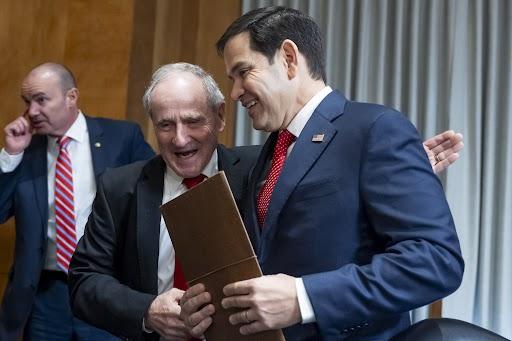 Senate Foreign Relations Committee Chairman James Risch embraces Sen. Marco Rubio, President-elect Trump's choice to be secretary of State, after his confirmation hearing on Jan. 15. (AP Photo/Alex Brandon)