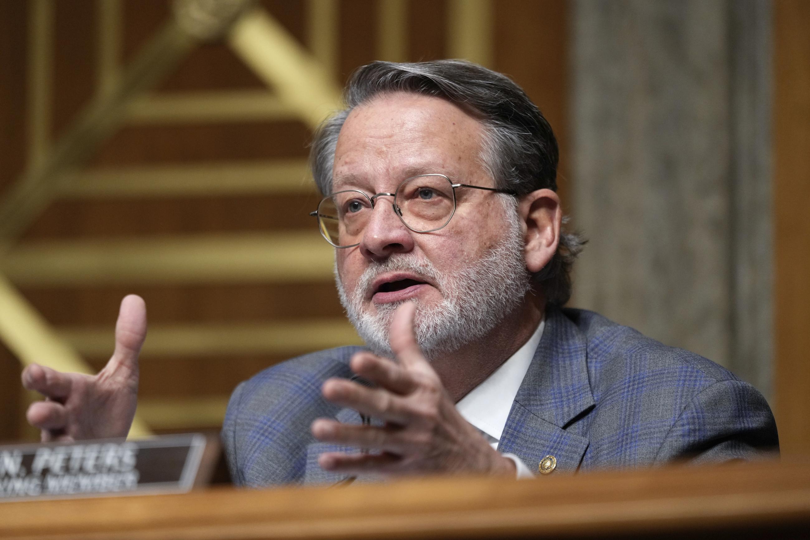 Ranking Member Gary Peters, D-Mich., speaks at the Senate Homeland Security and Governmental Affairs Committee confirmation hearing for South Dakota Gov. Kristi Noem, President-elect Donald Trump's nominee to be Secretary of Homeland Security, at the Capitol in Washington, Friday, Jan. 17, 2025. (AP Photo/Ben Curtis)