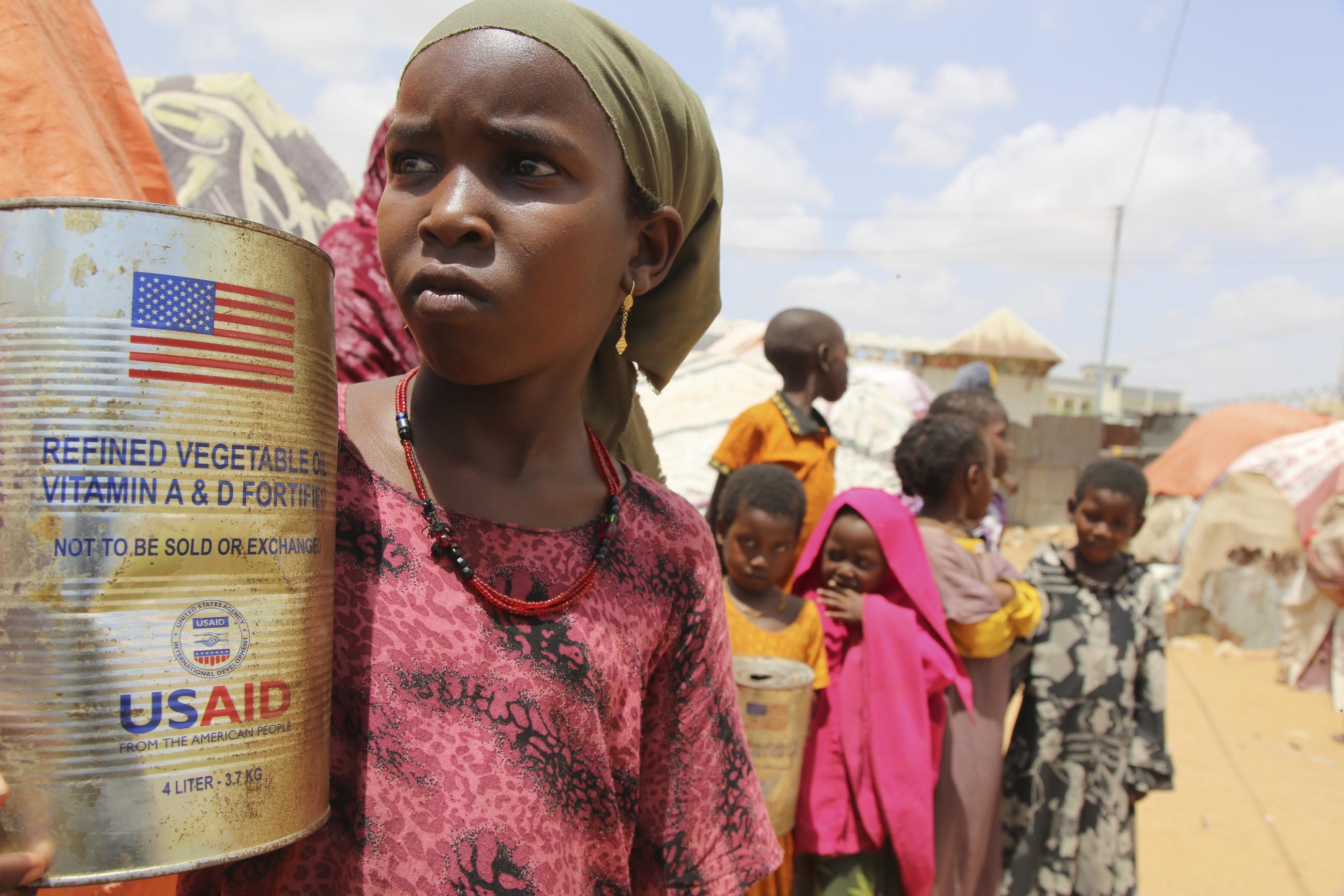 Internally displaced children look out from makeshift homes on the outskirts of Mogadishu, Somalia, on Feb. 5. (AP Photo/Farah Abdi Warsameh)