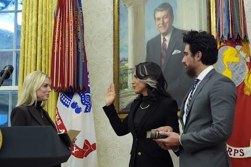 Attorney General Pam Bondi swears in Tulsi Gabbard ias the director of National Intelligence in the Oval Office on Wednesday, as Gabbard's husband, Abraham Williams, holds the Bible. (Photo/Alex Brandon)