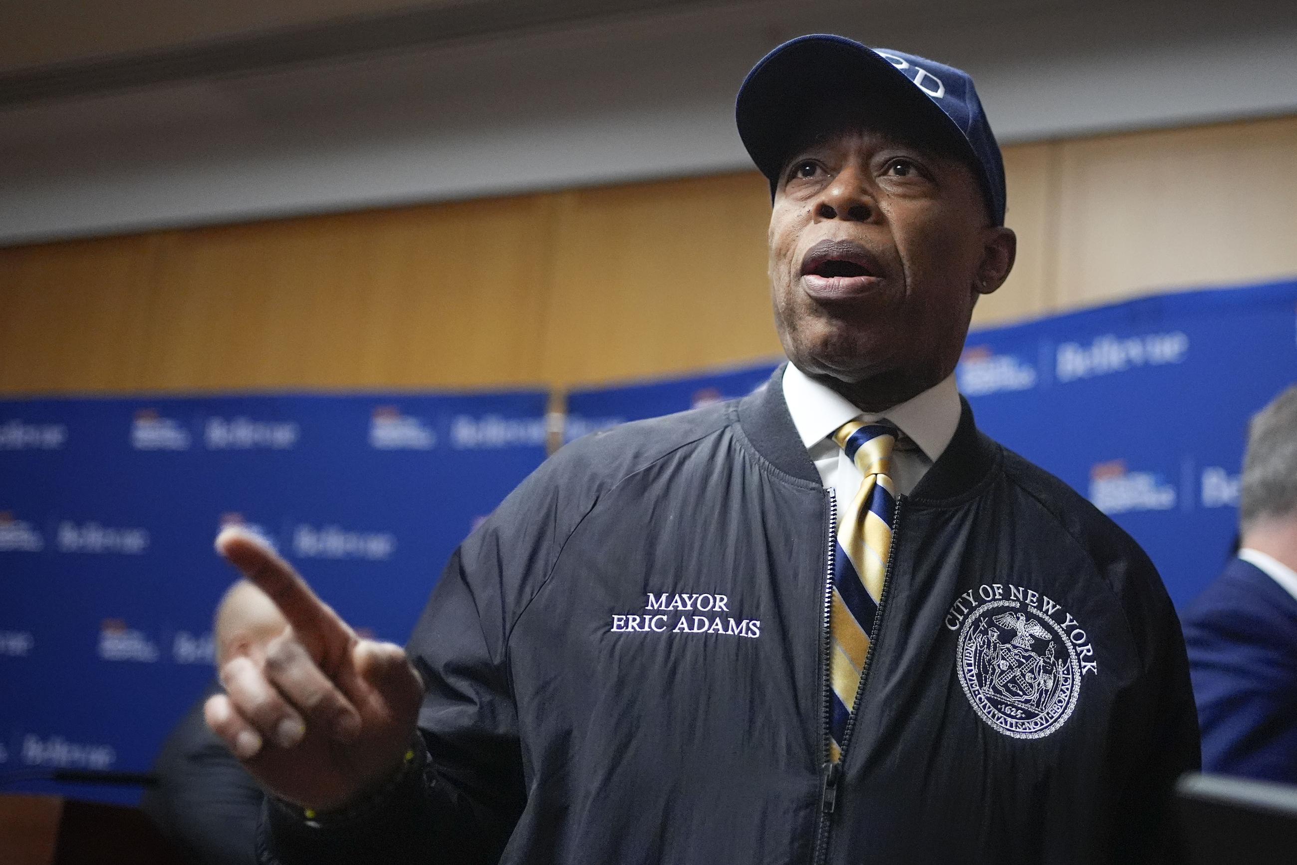 New York City mayor Eric Adams speaks to reporters as he leaves a news conference in New York, Tuesday, Feb. 18, 2025. (AP Photo/Seth Wenig)