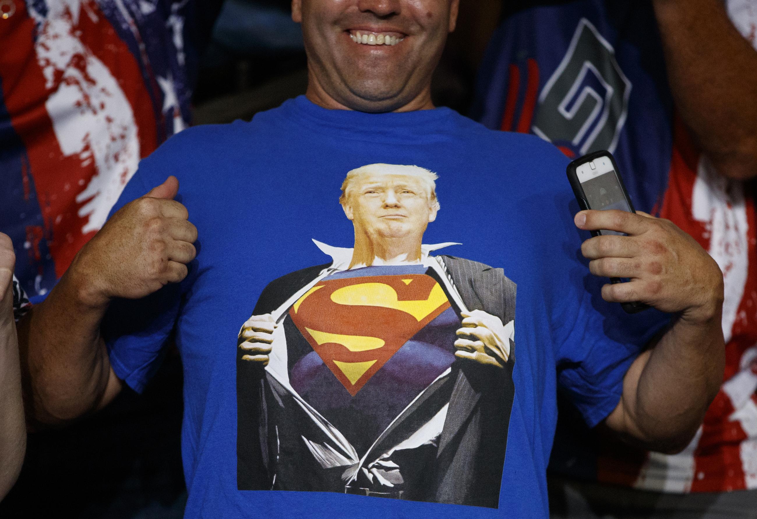 A supporter of President Trump wears a t-shirt with the image of the president as Superman at a campaign rally in 2019. (AP Photo/Carolyn Kaster)