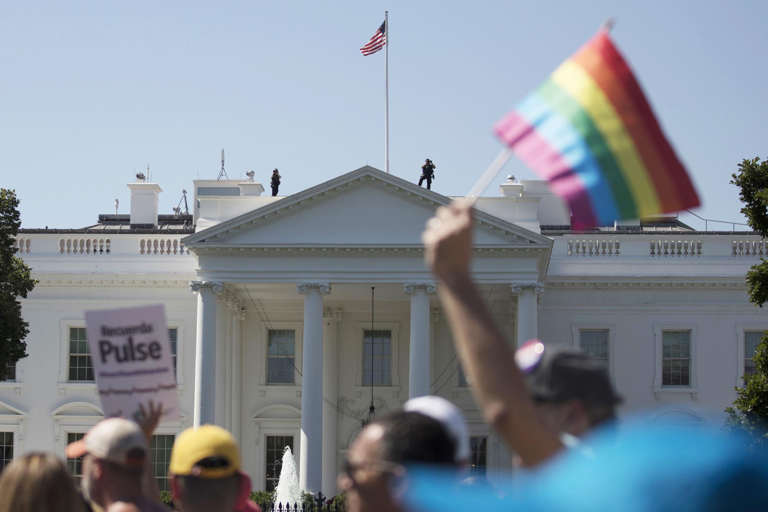 Equality March for Unity and Pride participants march past the White House in Washington in 2017. (AP Photo/Carolyn Kaster)