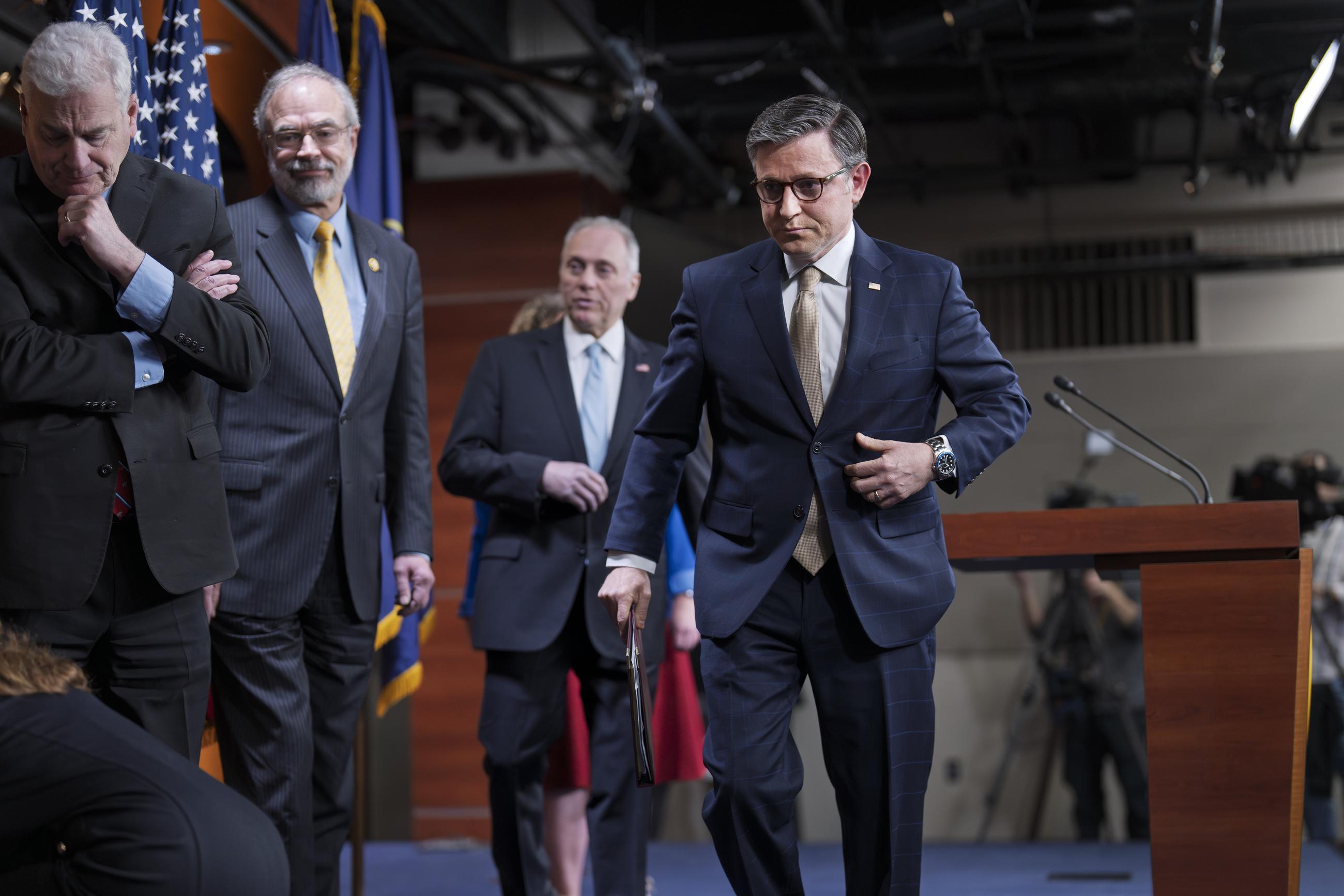 House Speaker Mike Johnson departs a news conference Tuesday, joined by Majority Whip Tom Emmer, Freedom Caucus Chair Andy Harris, and Majority Leader Steve Scalise. (AP Photo/J. Scott Applewhite)