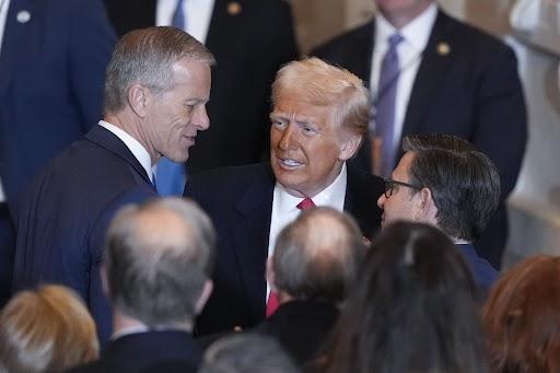 President Trump talks to Senate Majority Leader John Thune and House Speaker Mike Johnson after he spoke at the National Prayer Breakfast at the Capitol on Feb. 6. (AP Photo/J. Scott Applewhite, File)
