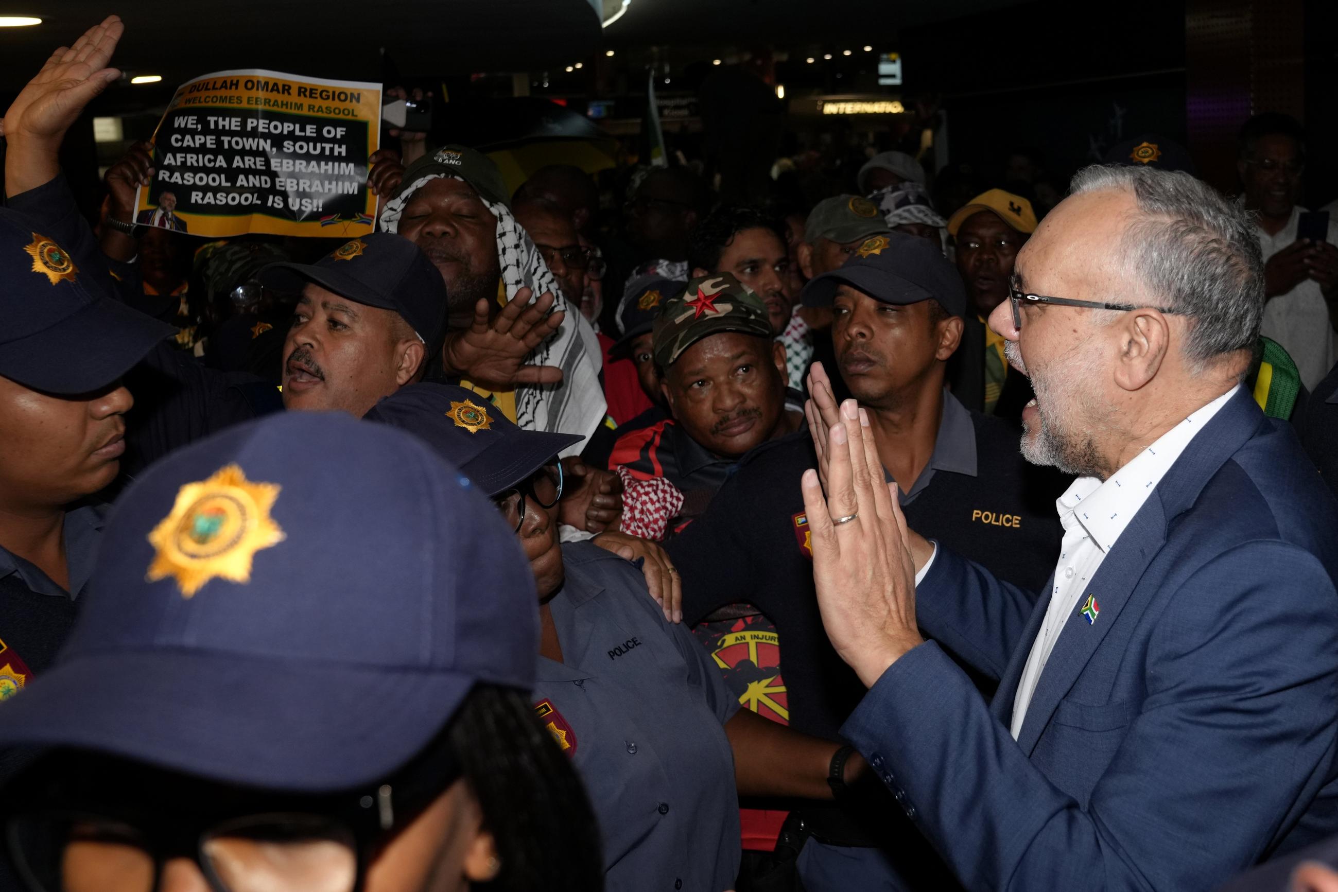 Ebrahim Rasool, the expelled South African ambassador to the U.S., speaks to supporters following his arrival in Cape Town on Sunday. (AP Photo/Nardus Engelbrecht)