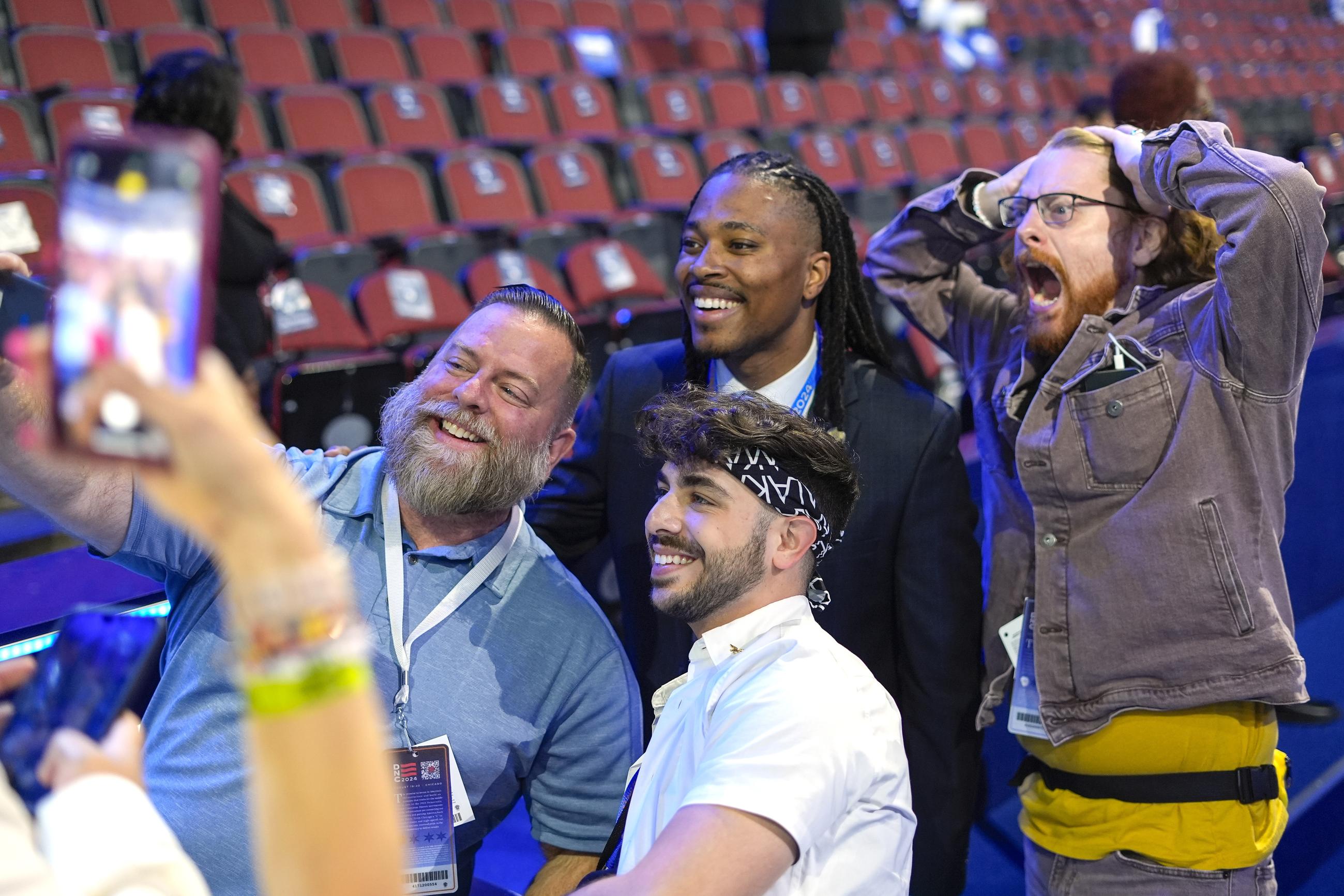 FILE - Malcolm Kenyatta, center, a member of the Pennsylvania House of Representatives, poses with DNC content creators Kory Aversa, from left, Johnny Palmadessa and Alexander Pearlman at the Democratic National Convention, Aug. 22, 2024, in Chicago. (AP Photo/Pablo Martinez Monsivais, File)