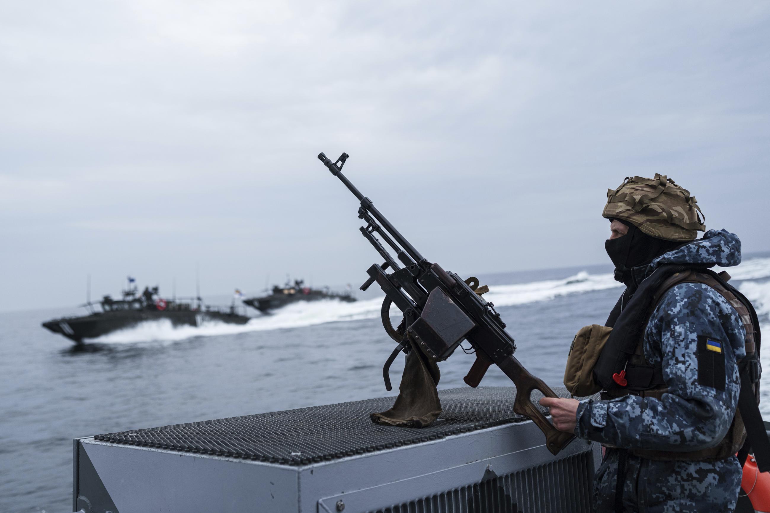 A Ukrainian serviceman stands on a boat during patrol over Black Sea coast line of Odesa region, Ukraine last week. (AP Photo/Evgeniy Maloletka)