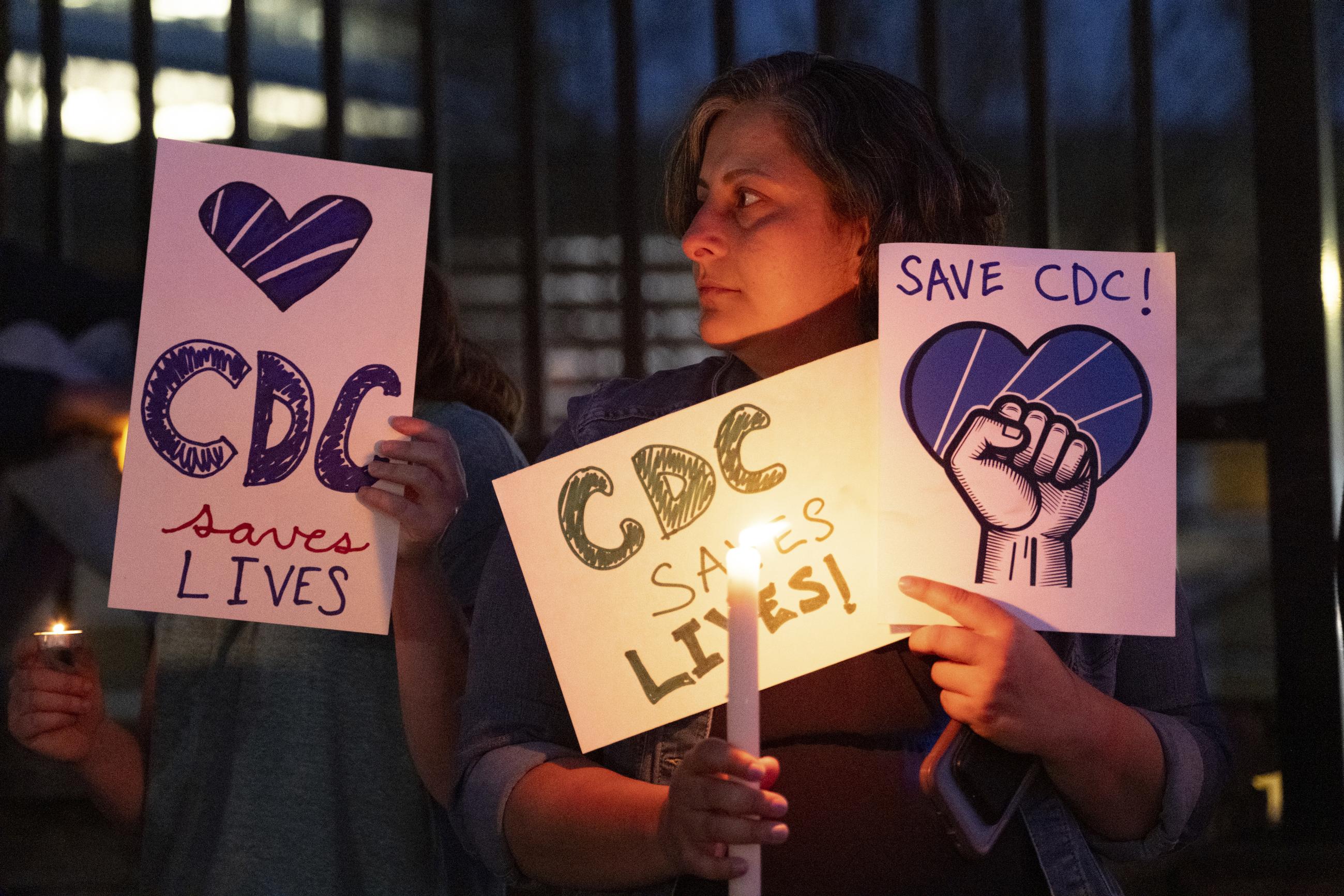 People gather for a candlelight vigil in support of the Centers for Disease Control and Prevention in front of its headquarters in Atlanta last month. (AP Photo/Ben Gray)