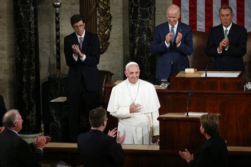 Then-Vice President Joe Biden, then-House Speaker John Boehner, and others applaud Pope Francis as he arrives to address a joint meeting of Congress in 2015. (AP Photo/Carolyn Kaster, file)